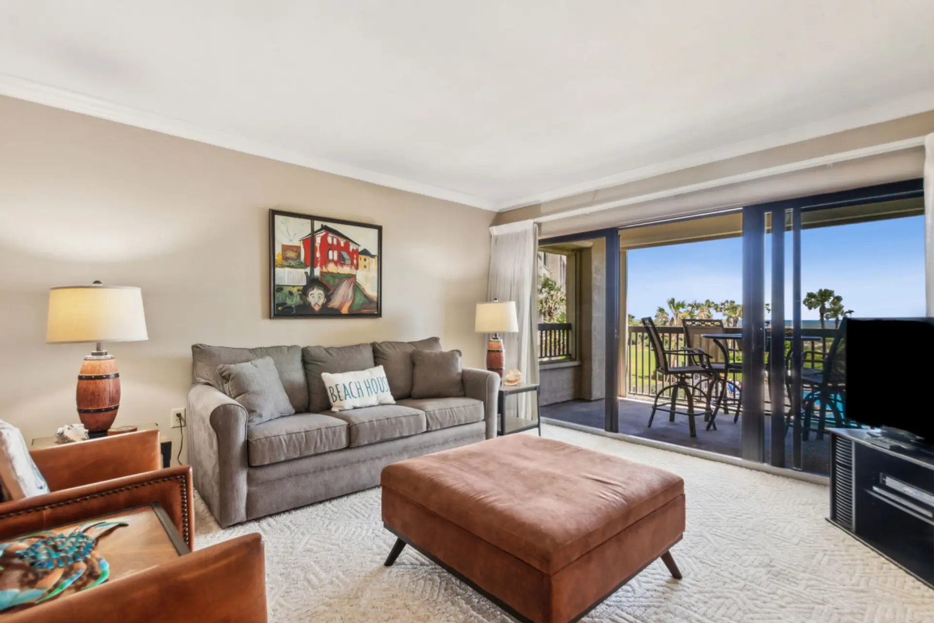 Living room with ocean view and covered balcony