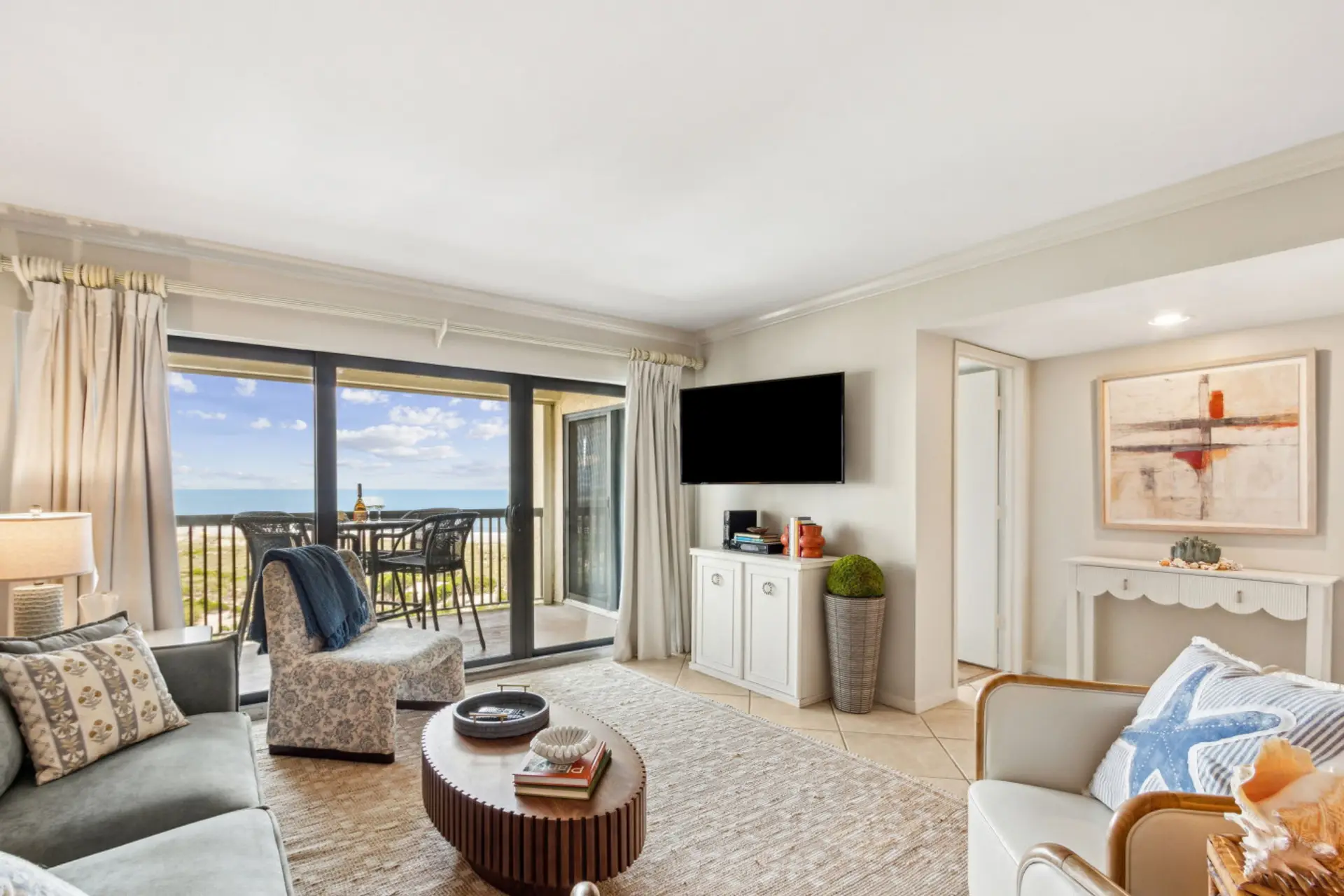 Living room with sliding glass door to covered balcony