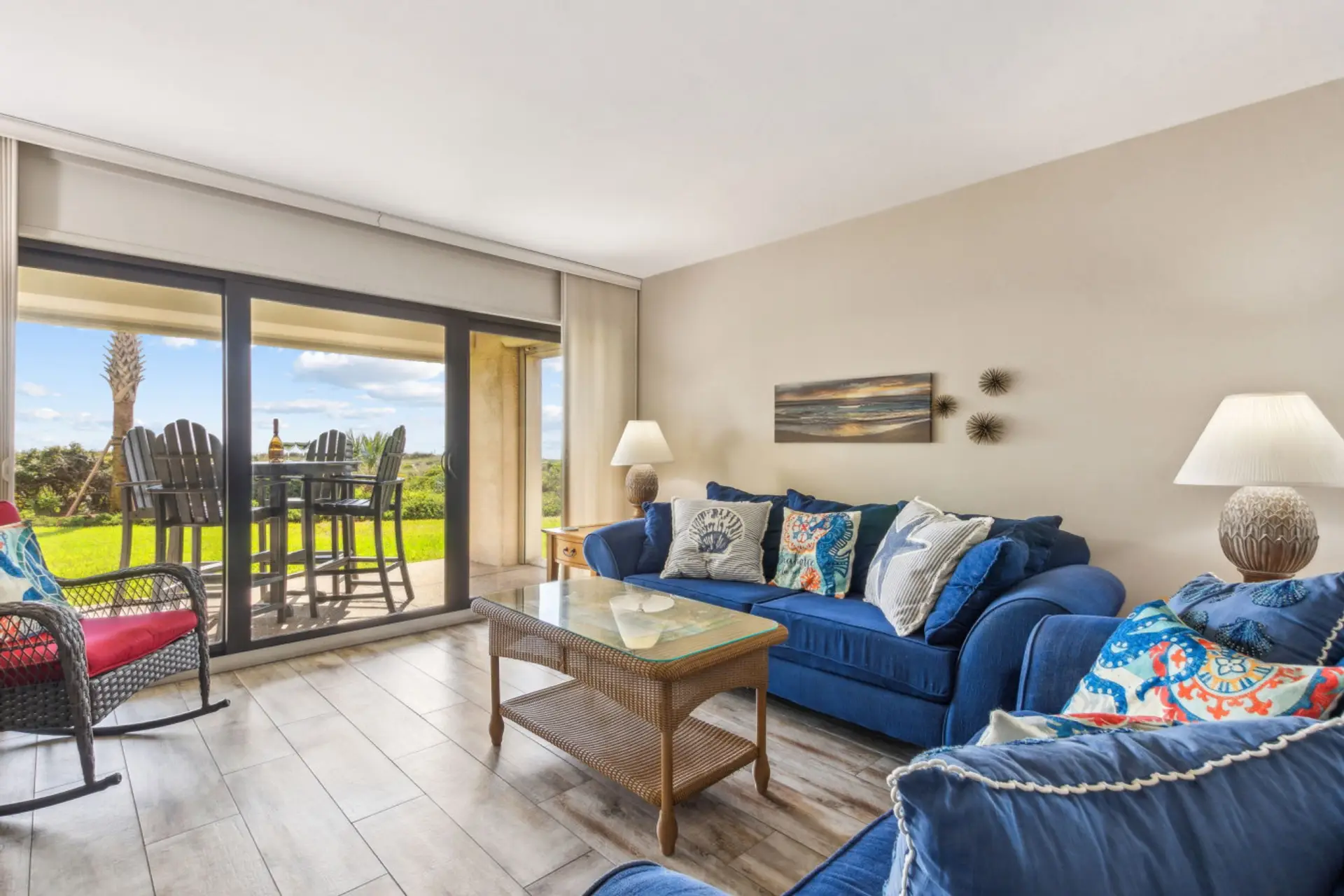 Living room with pull out sofa , cable tv, and sliding glass door to patio