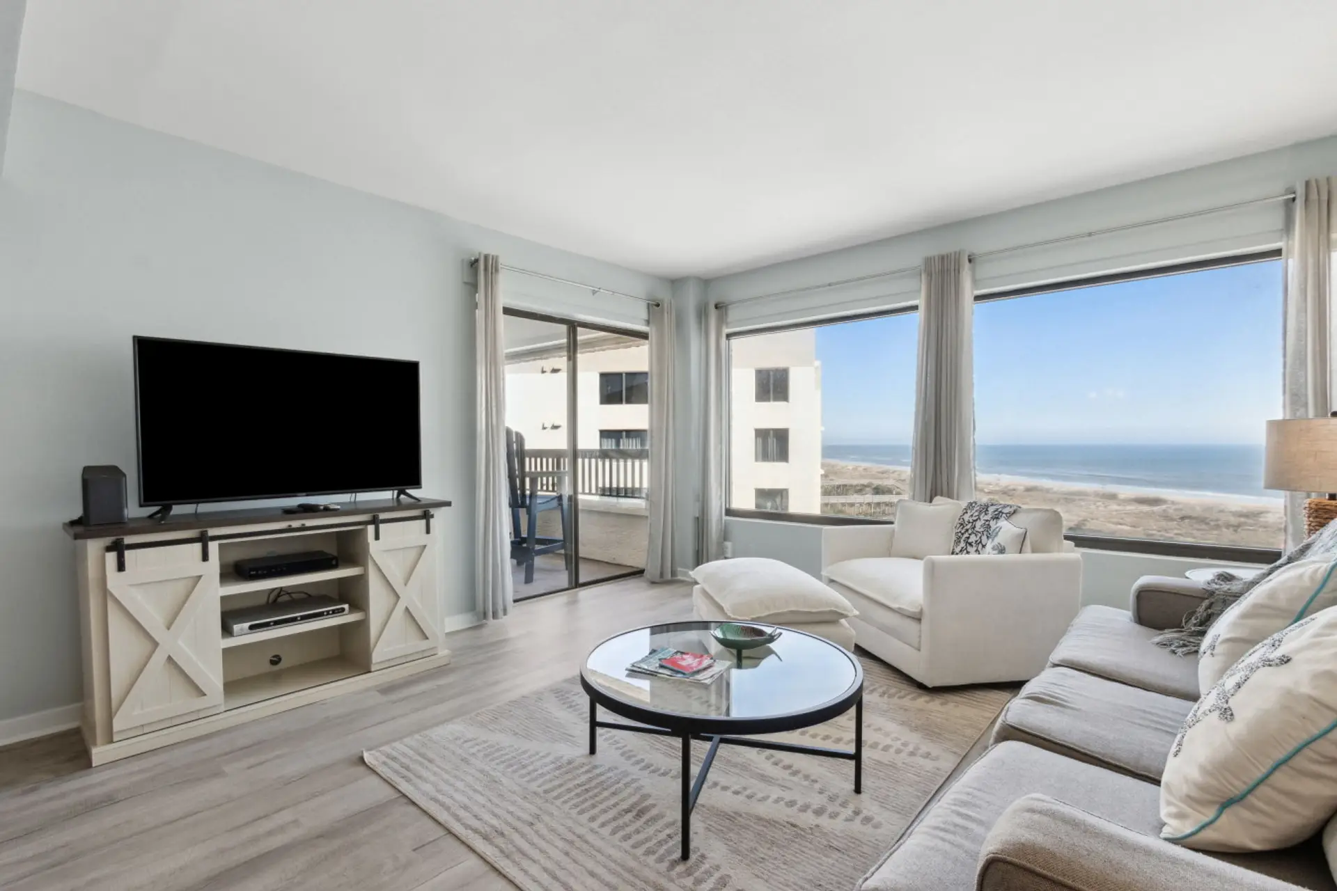 Living room with ocean views and covered balcony