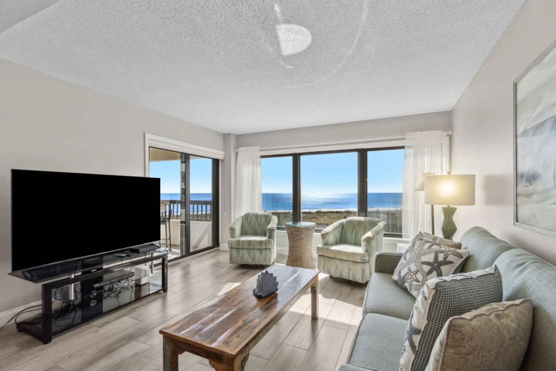 Living room with cable tv and ocean views