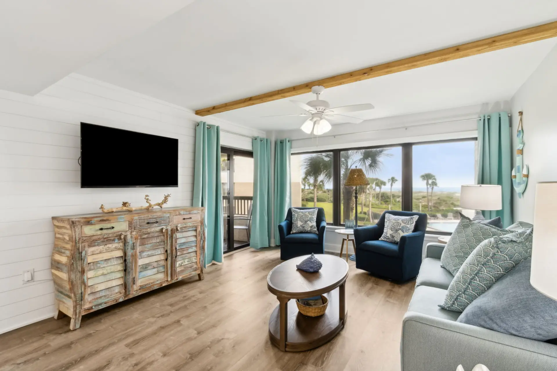 Living room with cable tv and ocean view
