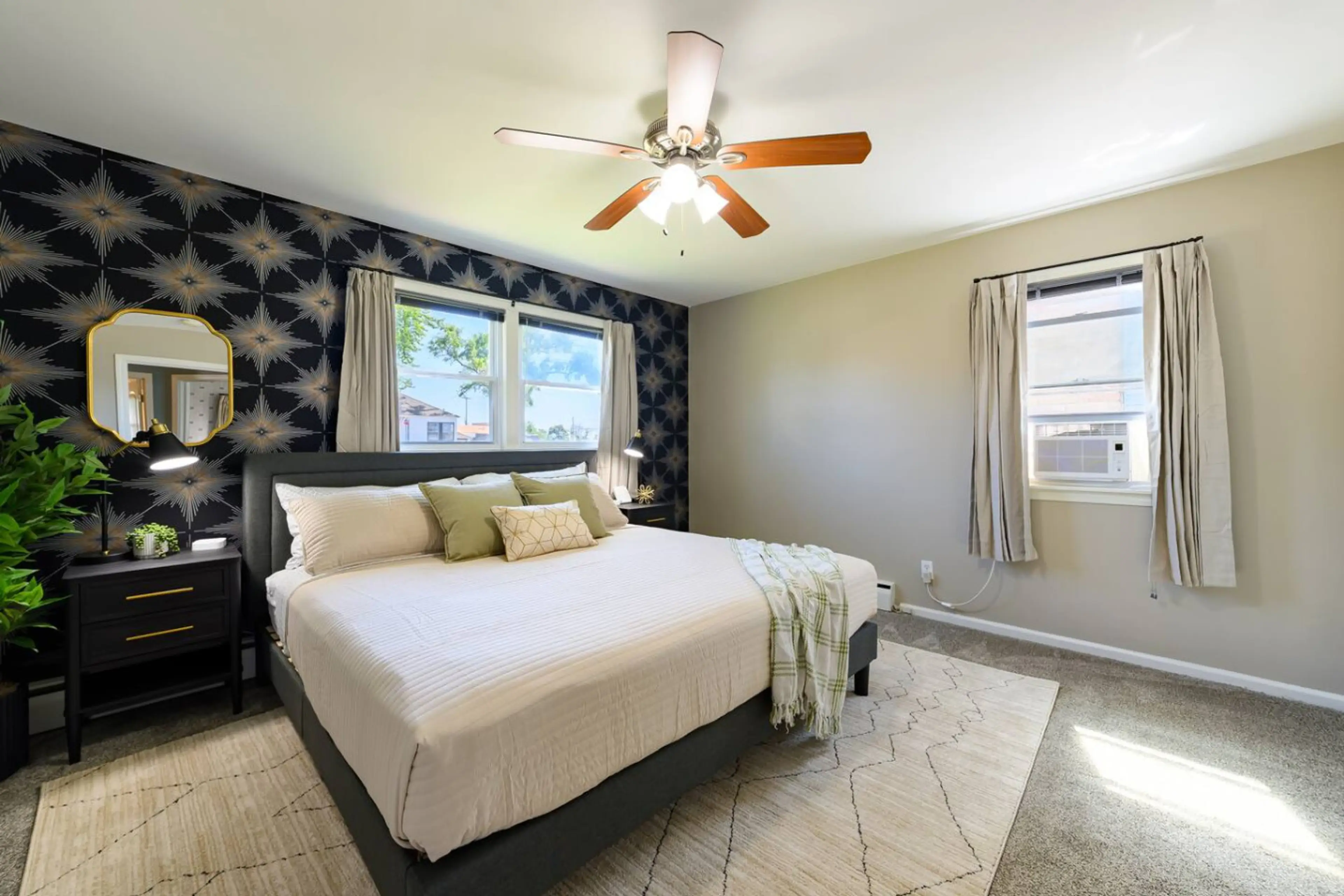 King bedroom with closet and seasonal window AC unit. USB hubs for charging and sound machine for peaceful sleep.