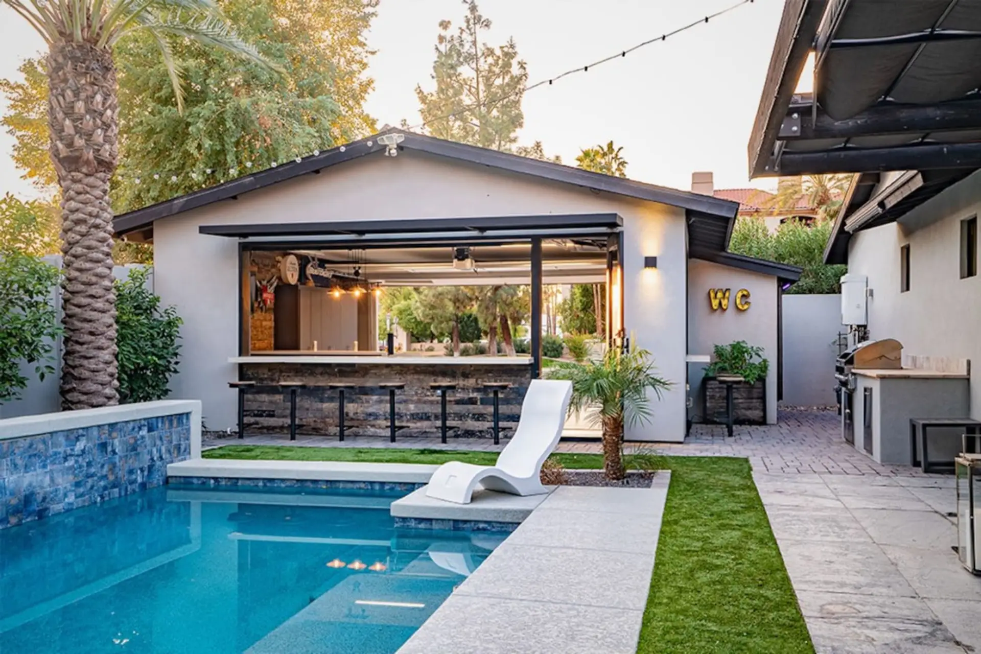 Pool, Waterfall, Backyard Bar, Ledge Lounger Chairs, Built in Grill