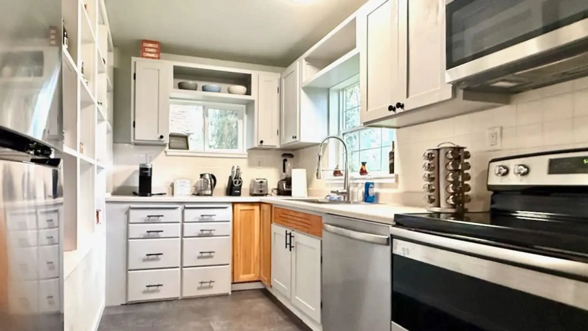 Bright kitchen with new appliances.  Fridge features an ice maker!  Keurig coffee maker.