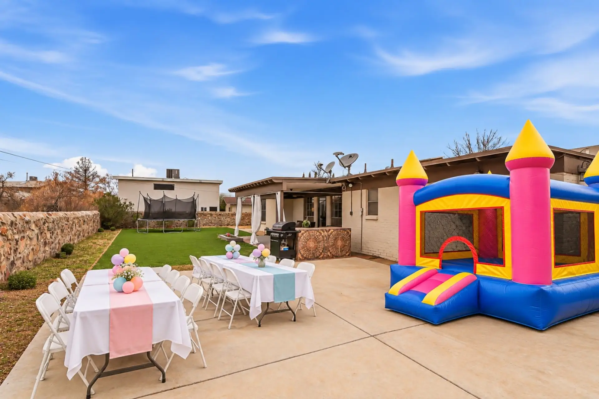 Illustrative setup only. Tables, chairs, decorations, and bounce house are not included.