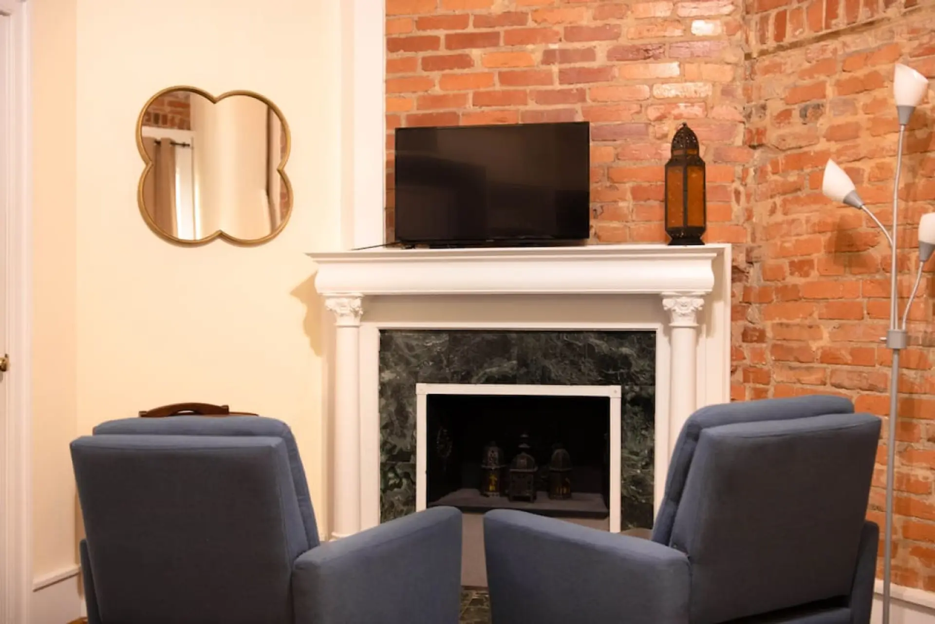 Cozy, efficiency style apartment. Relax and watch TV from the comfortable arm chairs. TV features and Amazon Firestick with Prime TV  for streaming and Fubo TV for live shows. Or login to your own apps and watch your favorite shows. Fireplace is decorativ