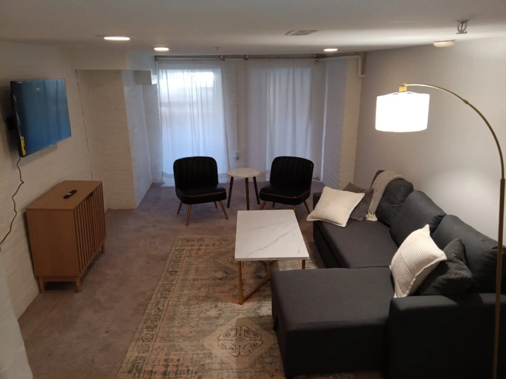Cozy living room with pull out couch and flat screen TV