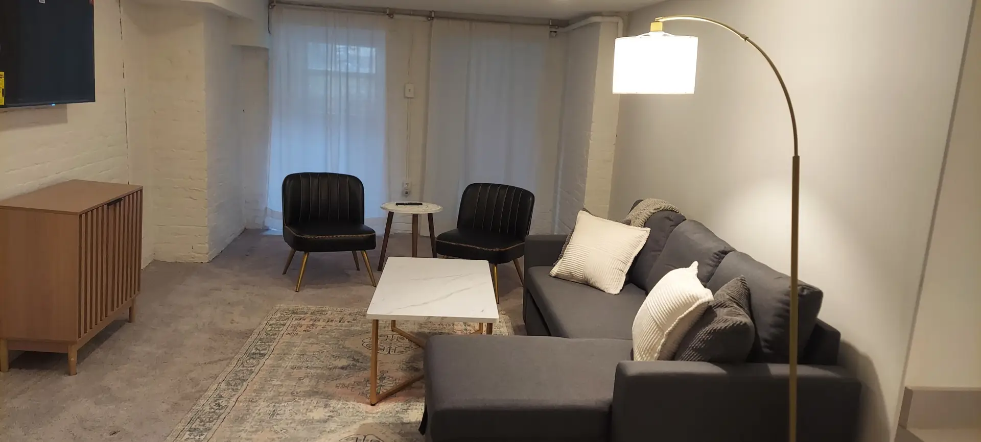 Cozy living room with a pull out couch and flat screen TV