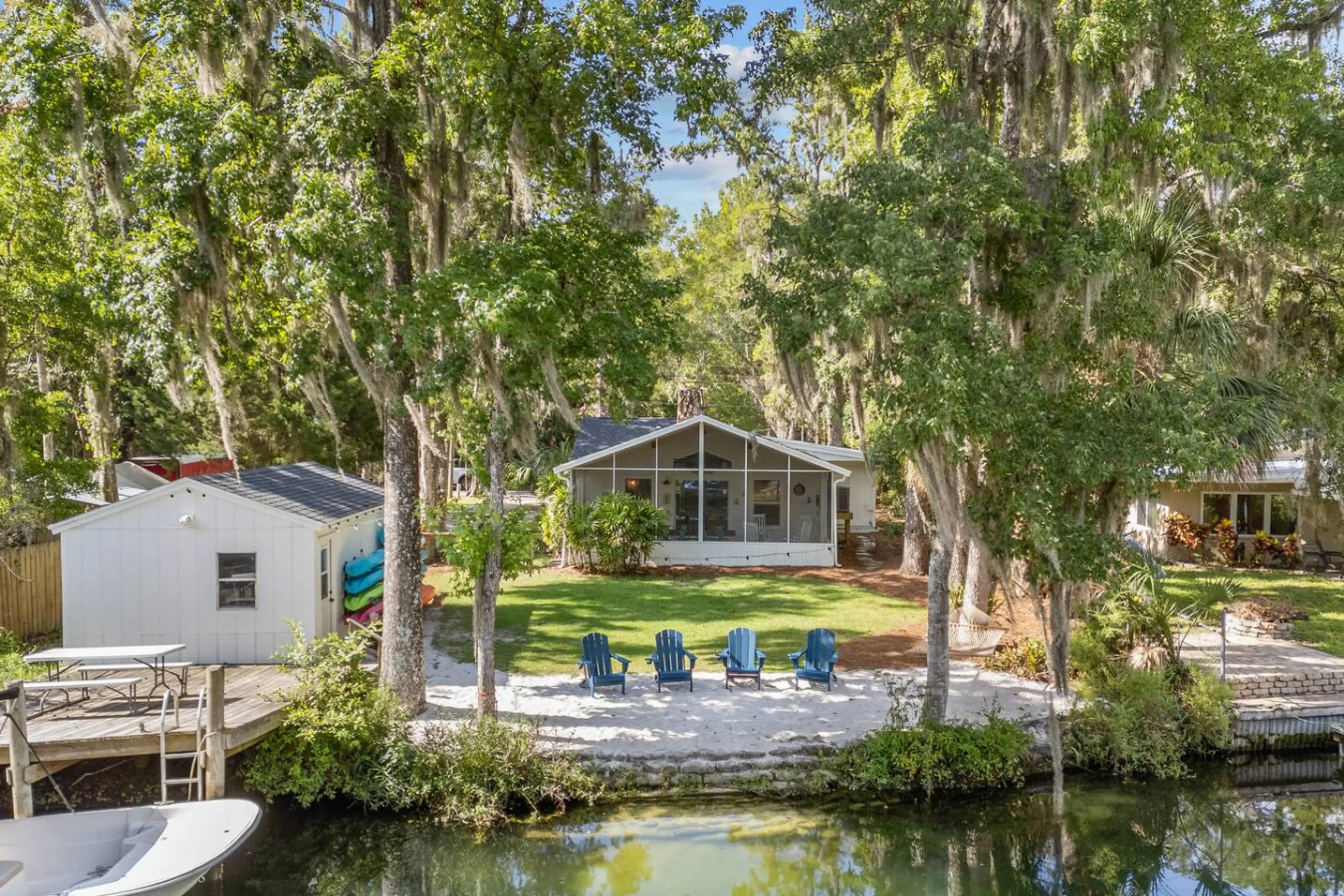 Front-row seats to the river  These Adirondack chairs were made for morning coffee, sunset drinks, and everything in between. The house, the water, and the breeze — all right here.