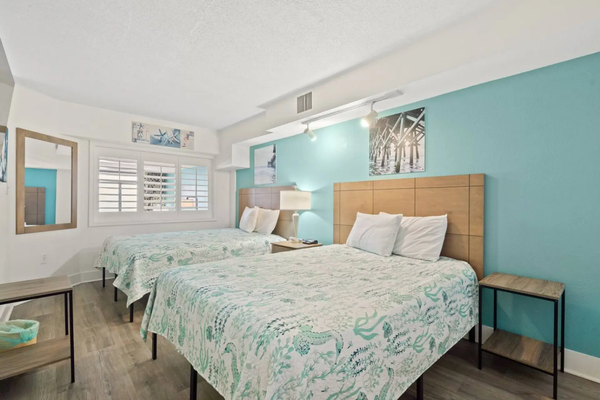 Bright, coastal-styled bedroom with a queen bed, the perfect retreat after a day in North Myrtle Beach.