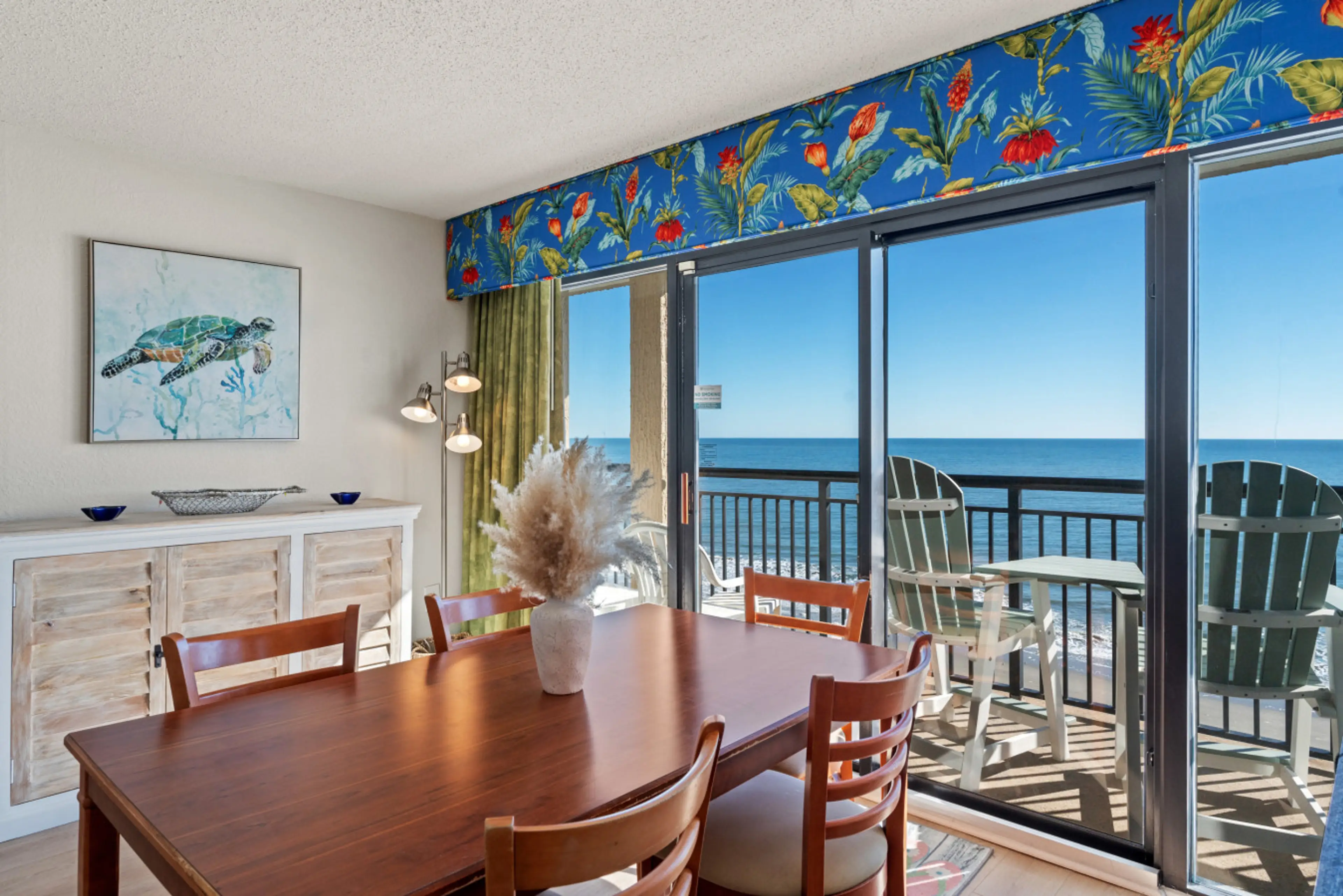 Oceanfront living room couch with direct views of the Atlantic. Relax on comfortable seating while floor-to-ceiling windows frame breathtaking North Myrtle Beach oceanfront scenery.