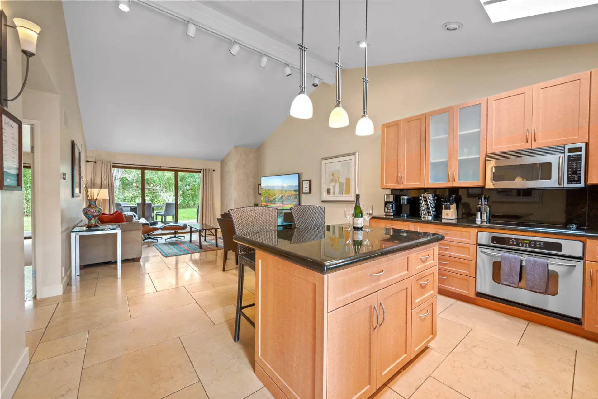 Open floor plan for kitchen and living room. New kitchen supplies, fully stocked! New 75 inch smart TV.  Golf views out rear patio