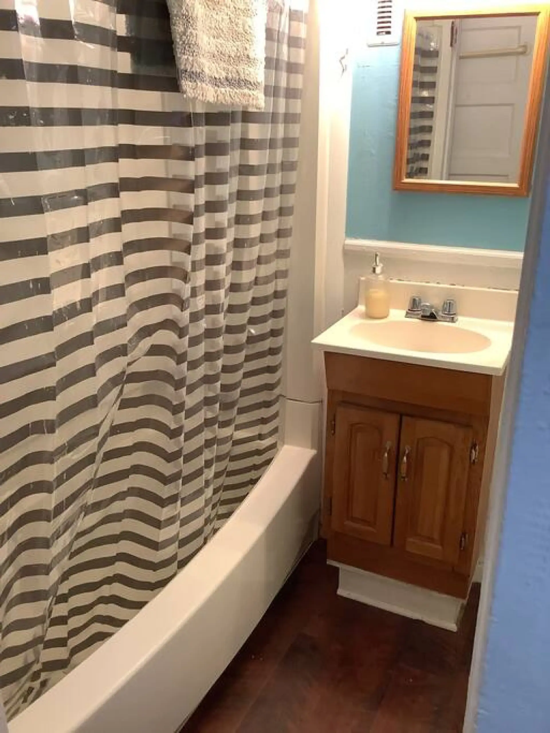 Full bathroom located off the kitchen.
