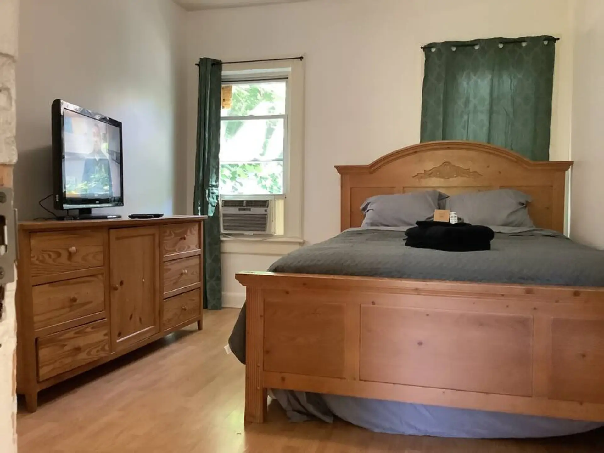 Bedroom 2. Equipped with a Queen size bed &  smart tv for your enjoyment.  Relax, wind down and get rested.