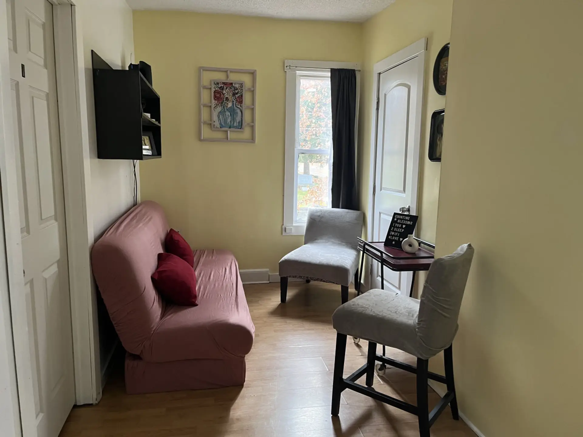 Enjoy this cozy, comfortable seating area located right off the kitchen.  Read a book or enjoy a cup of coffee.