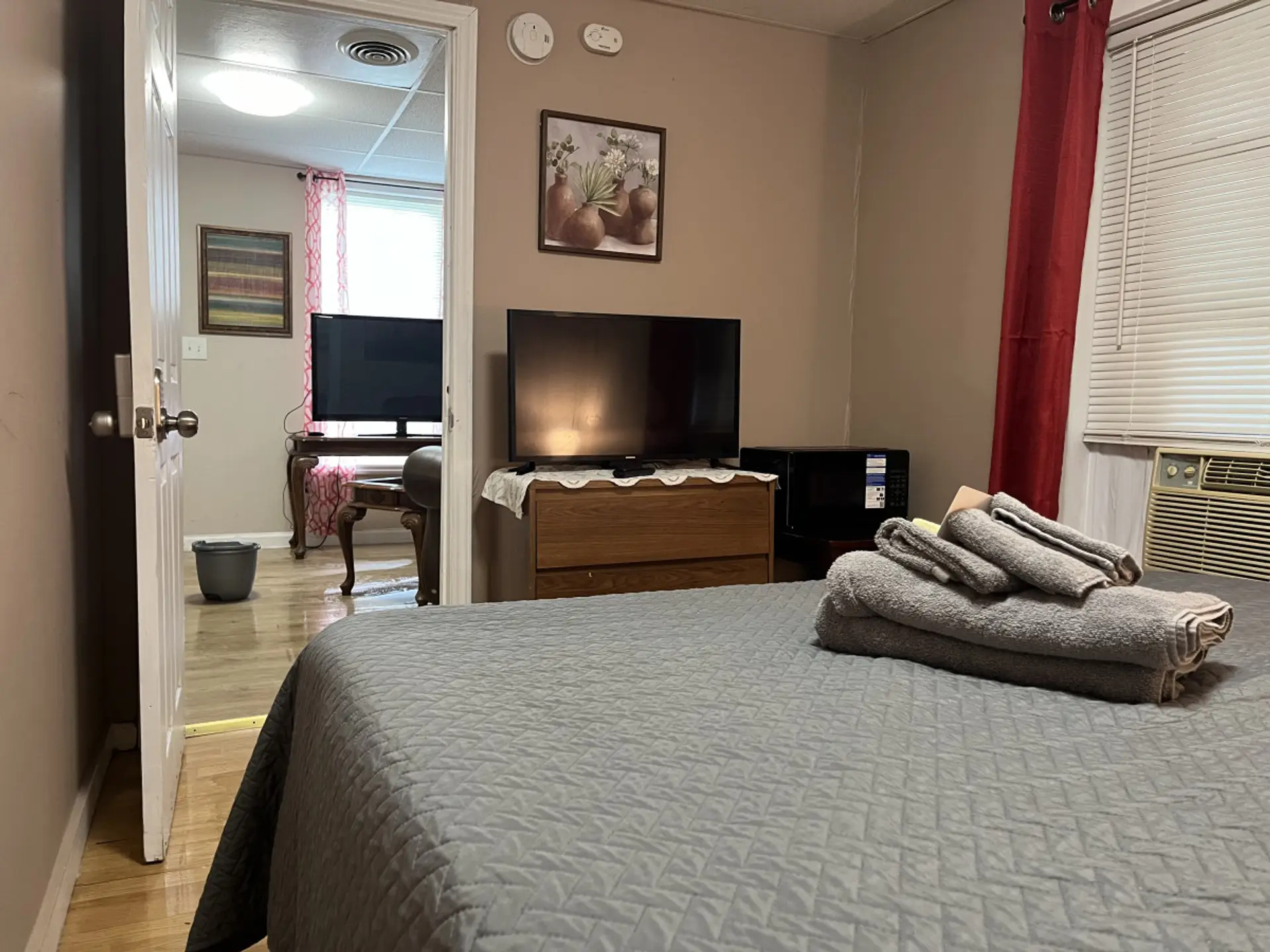 Discover comfort in our cozy bedrooms, each with a plush queen-size bed for a restful night’s sleep. Enjoy the tranquility, with a minifridge, microwave, dresser, and smart TV. Experience the perfect blend of relaxation and comfort during your stay.