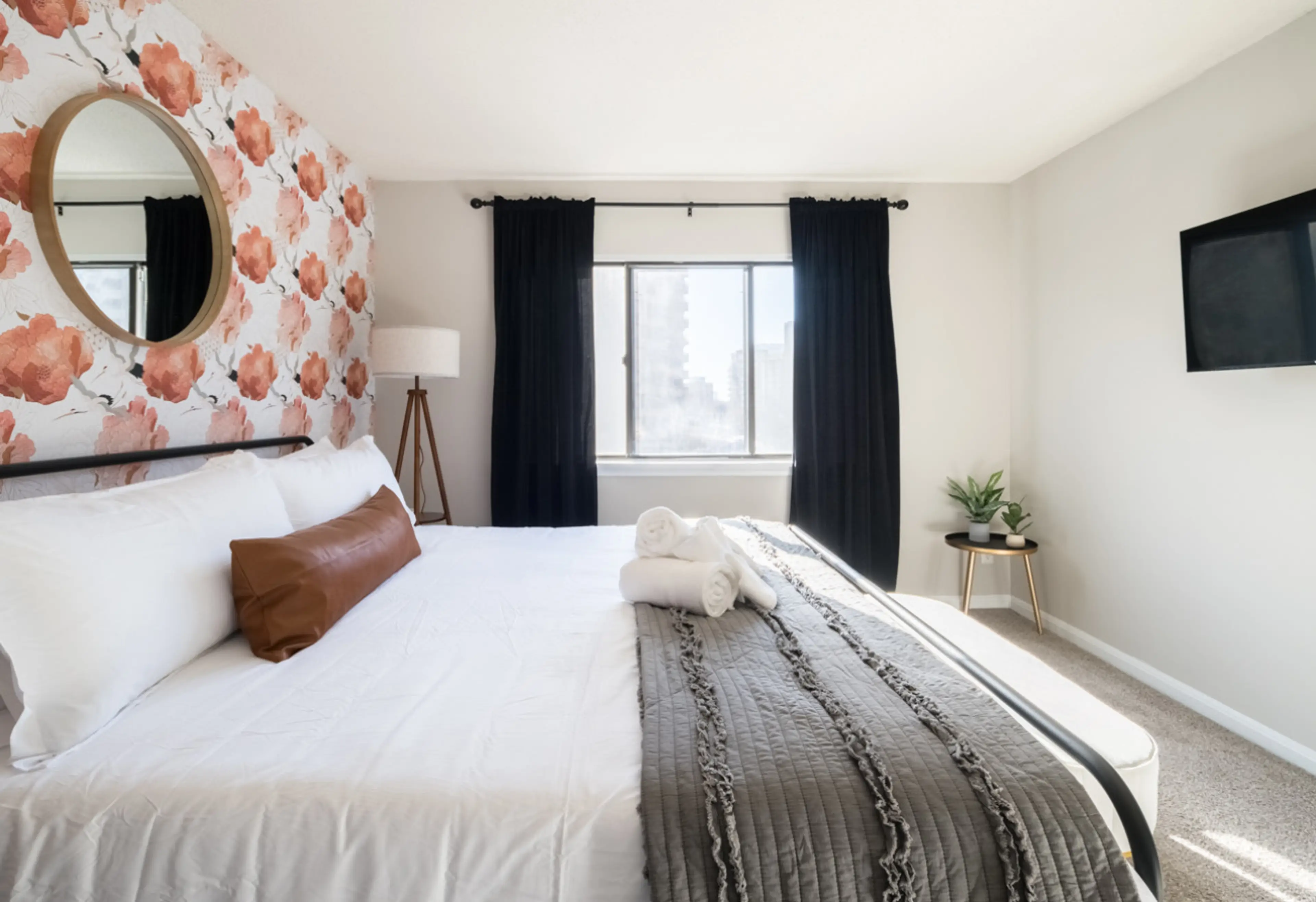 Relax with a 40" smart tv in each bedroom. This bedroom has a plush King bed you can curl up in after a long day of sight seeing.