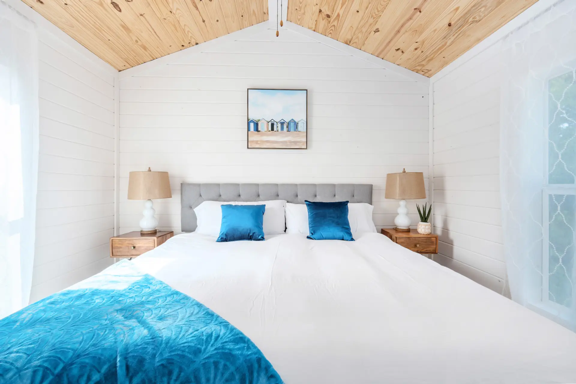 Comfortable king bedroom with soft linens, calming colors, and a peaceful place to truly relax.