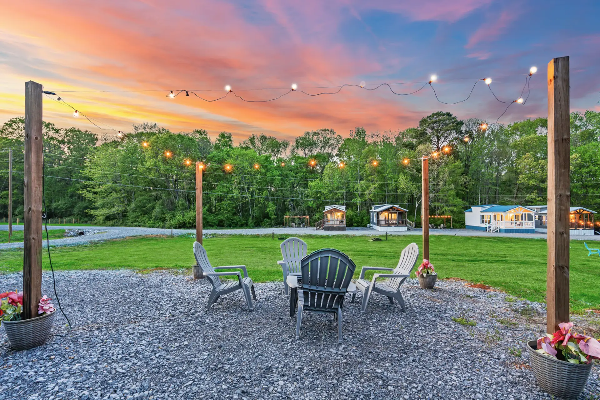 Outdoor Lounge: Unwind under twinkling lights and stunning sunsets at your private firepit oasis!