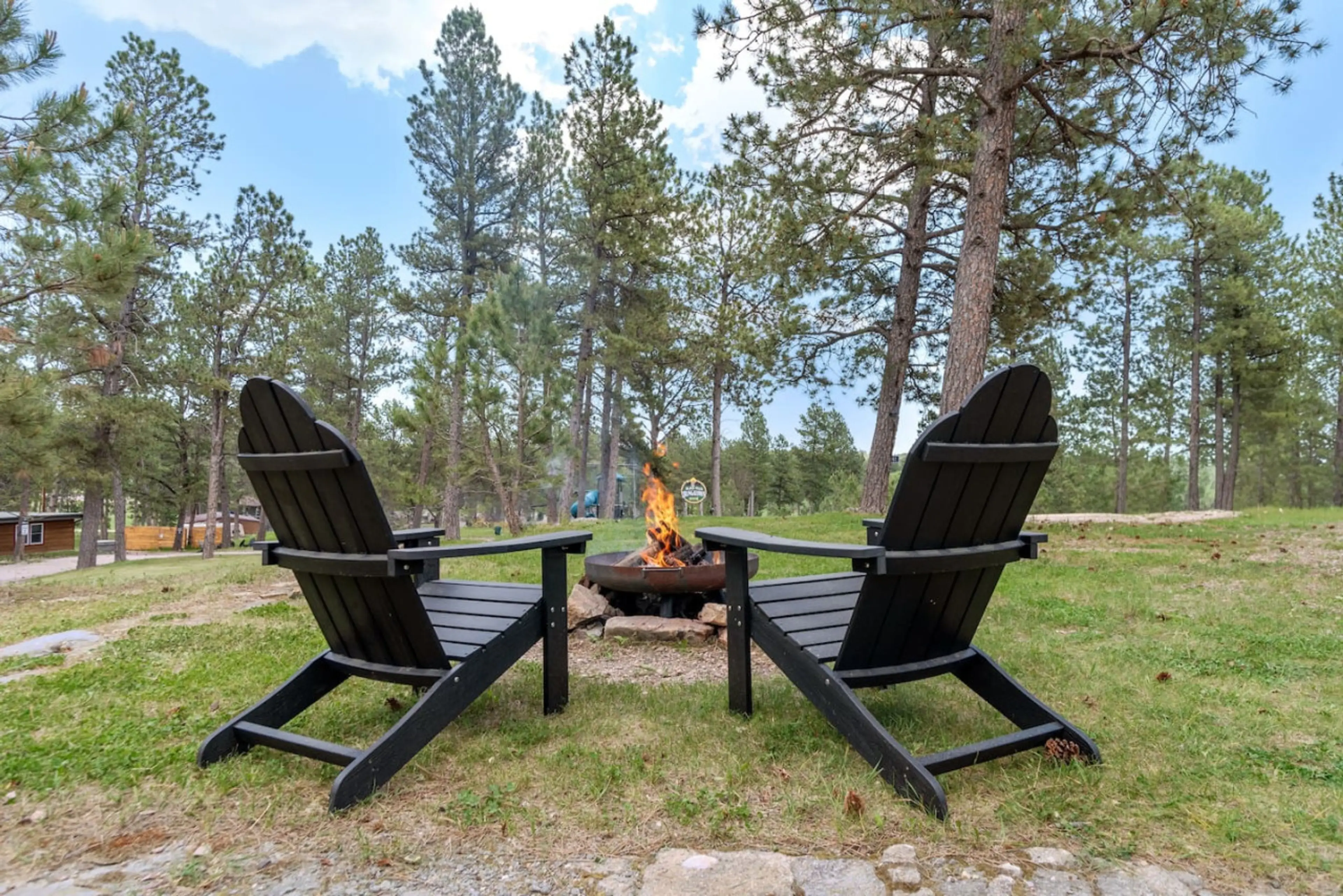 Stay warm and toasty by the firepit outside our inviting cabin.