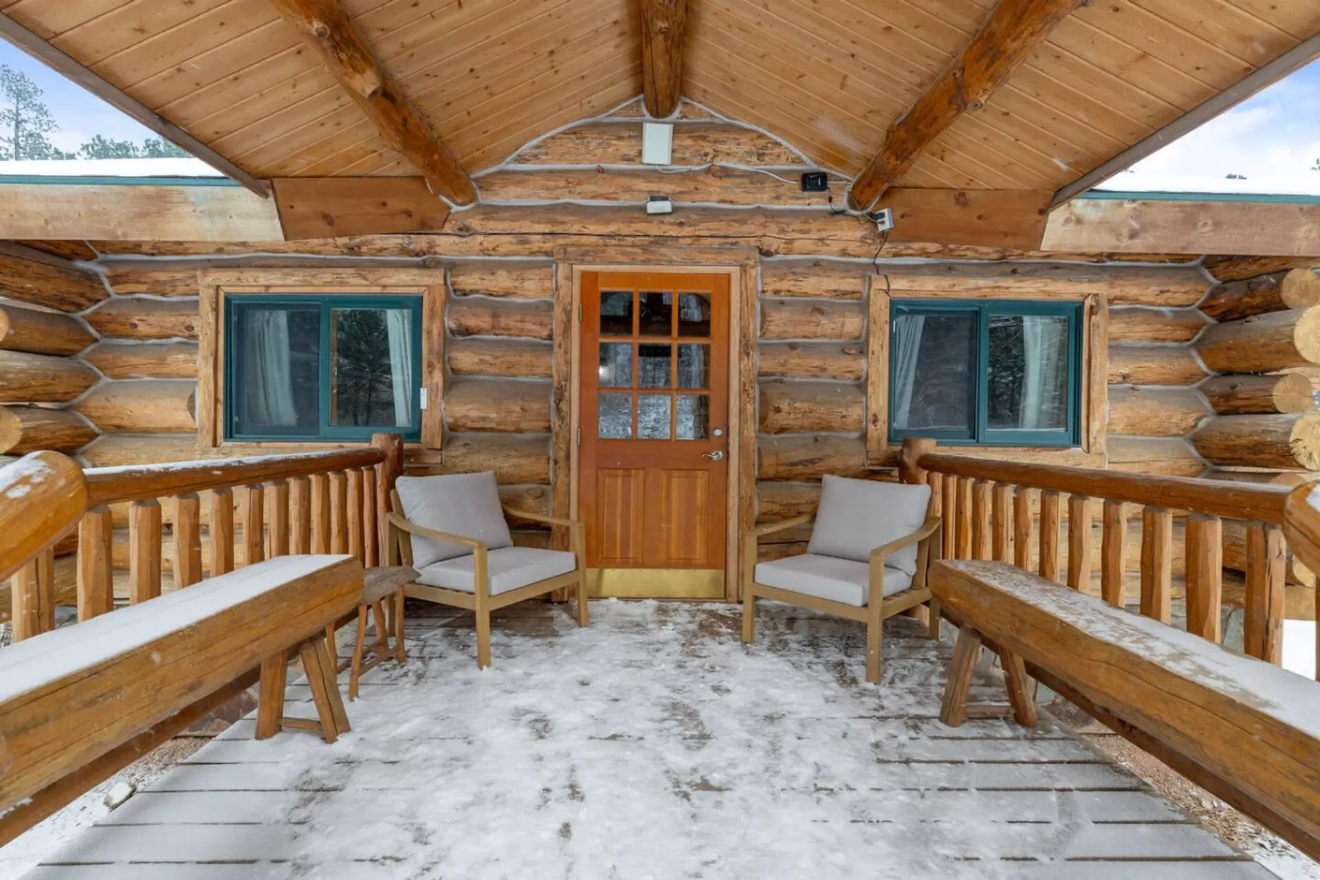 Experience rustic elegance with our cozy cabin exterior.