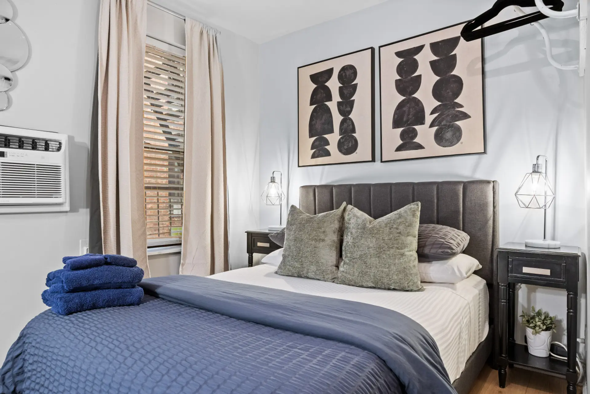A snug double bed with fluffy pillows