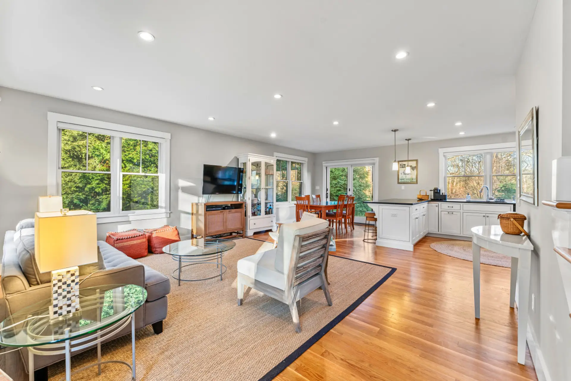 This open layout smoothly blends the dining, living, and kitchen spaces together.