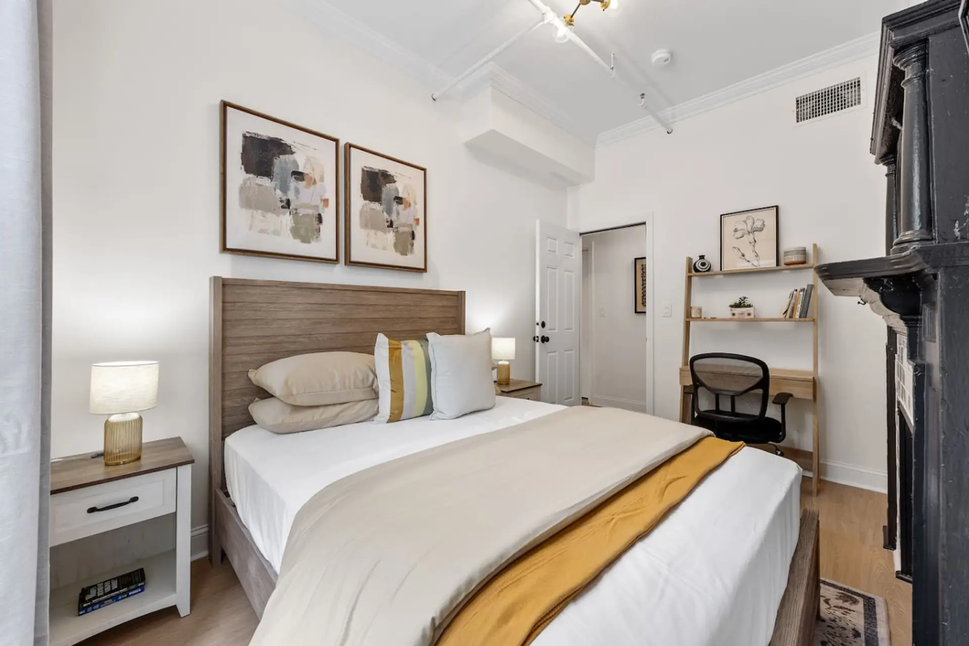 Relax and unwind in this cozy and stylish bedroom! Featuring a comfortable queen-sized bed, a dedicated workspace for your convenience, and beautiful natural light.