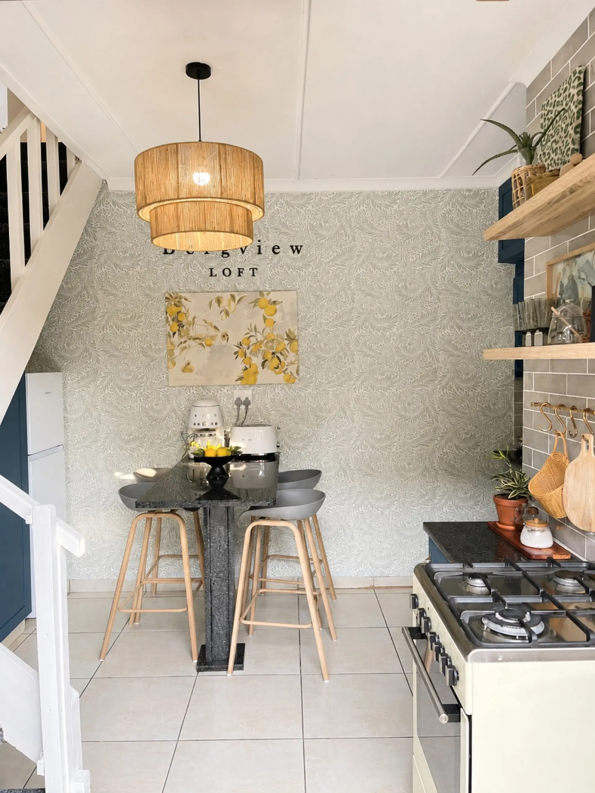 Kitchen with staircase leading to bedrooms