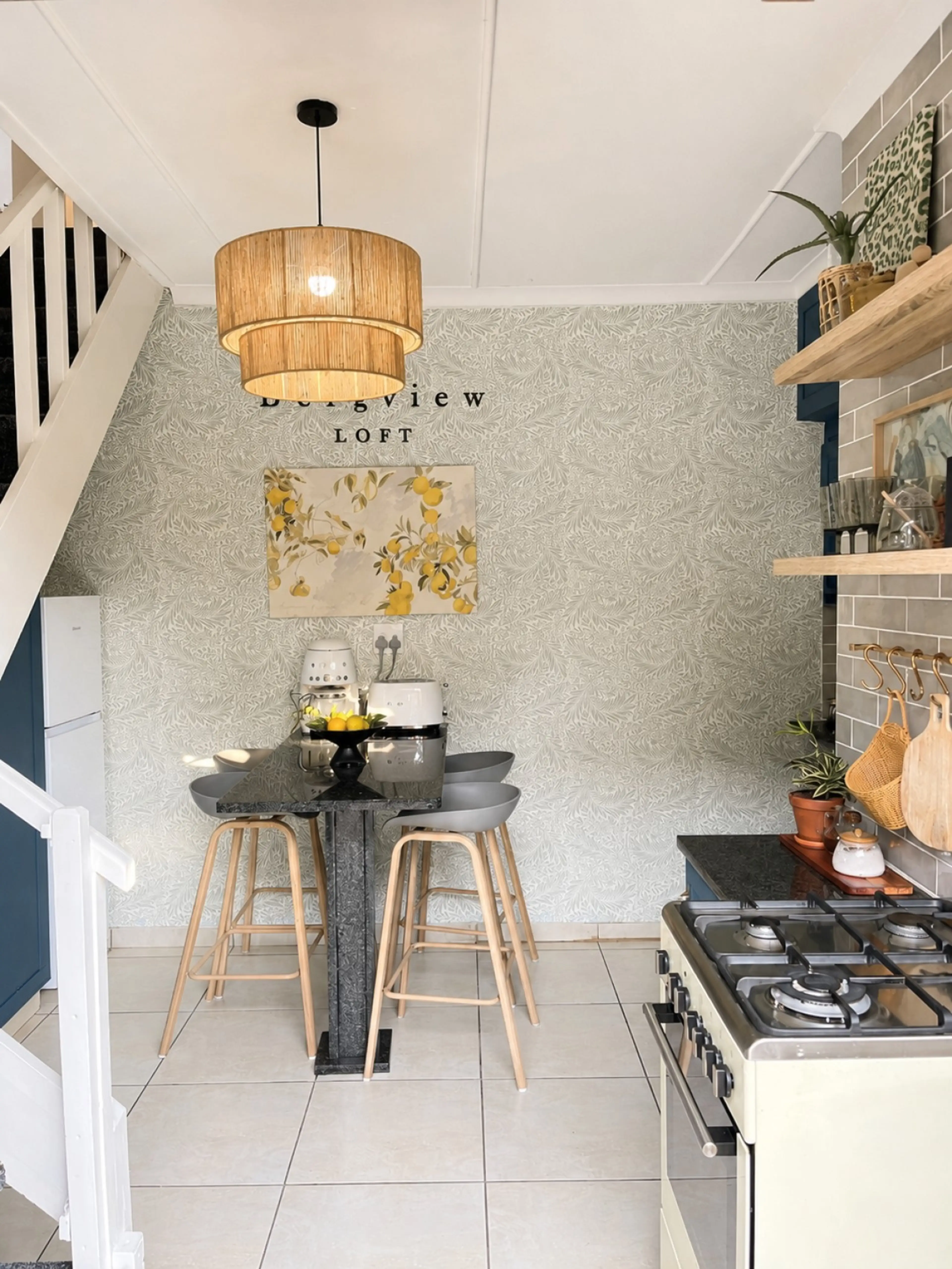 Kitchen with staircase leading to bedrooms