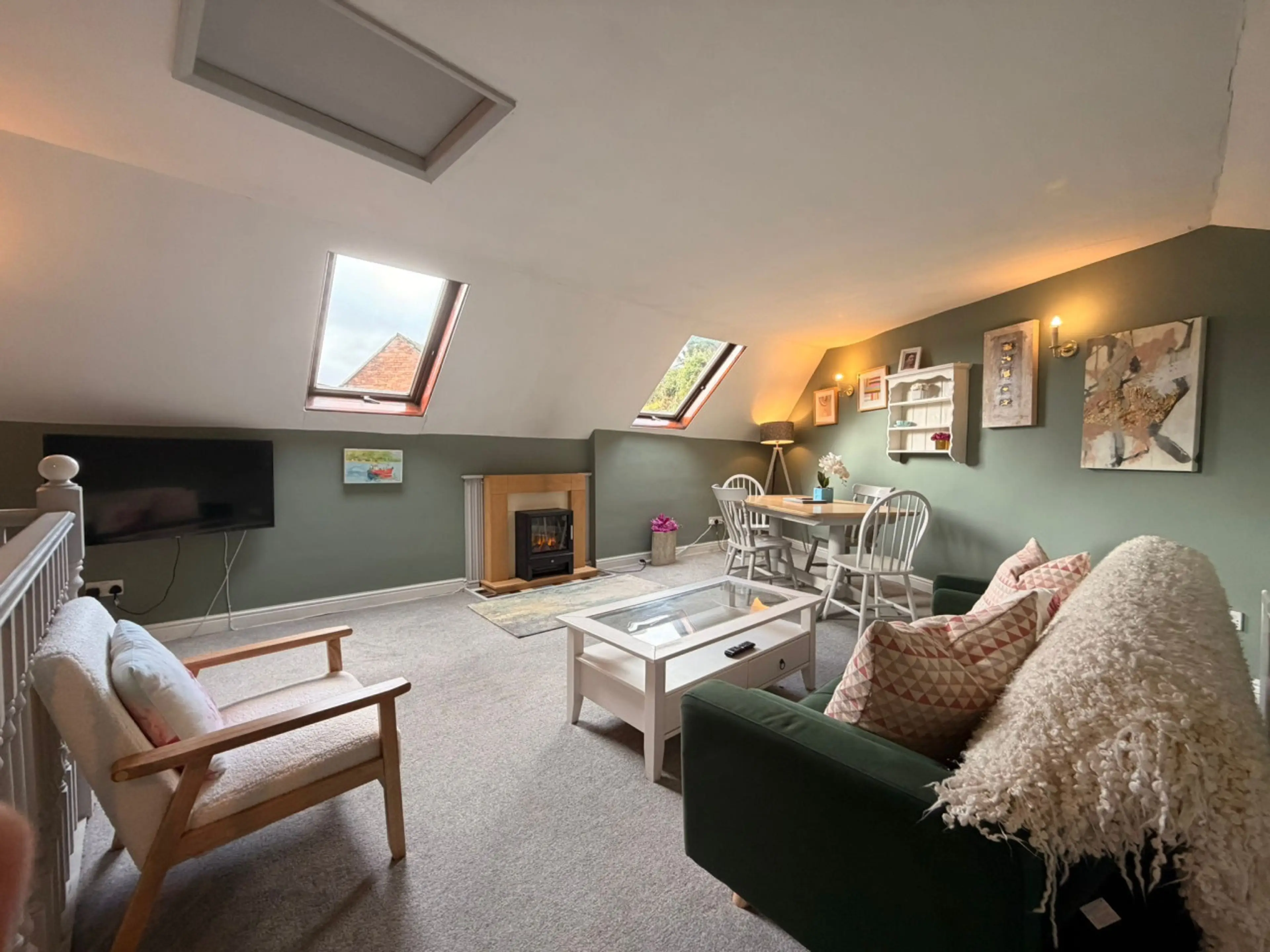 Upstairs Lounge with smart Tv and electric fire