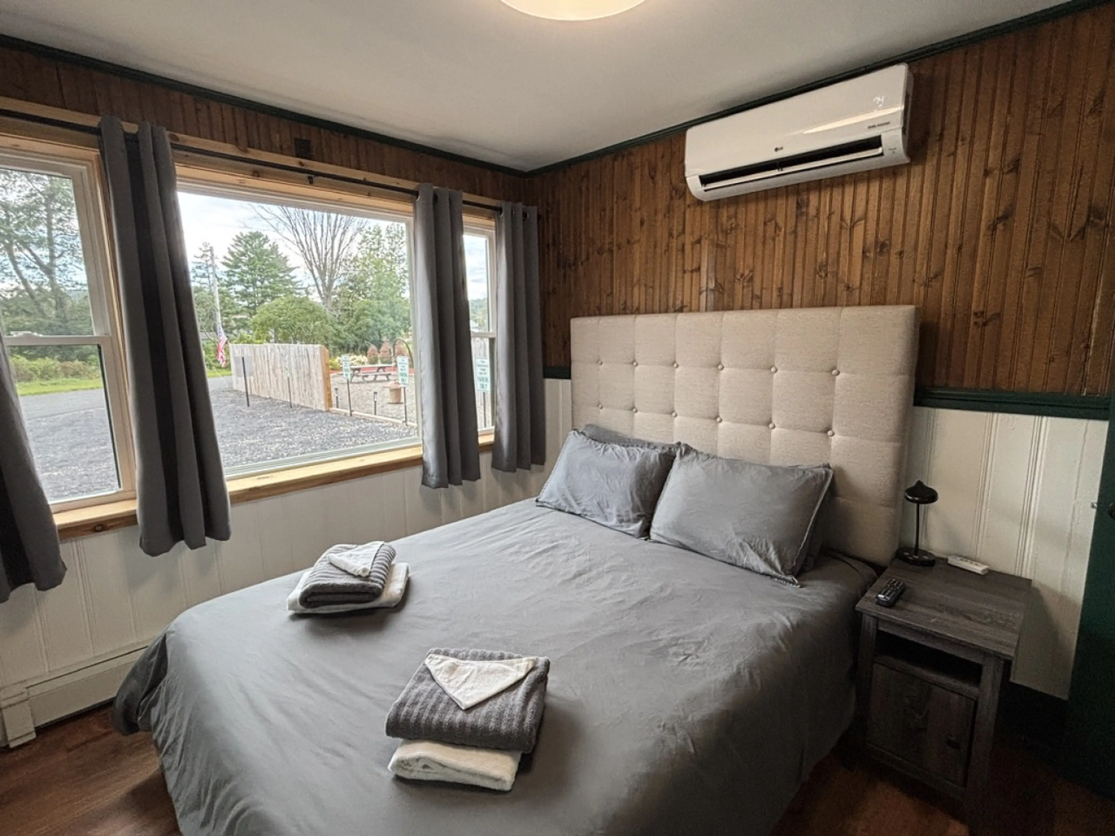 Bedroom # 1. Queen bed with large 55 in Smart TV and ductless AC.