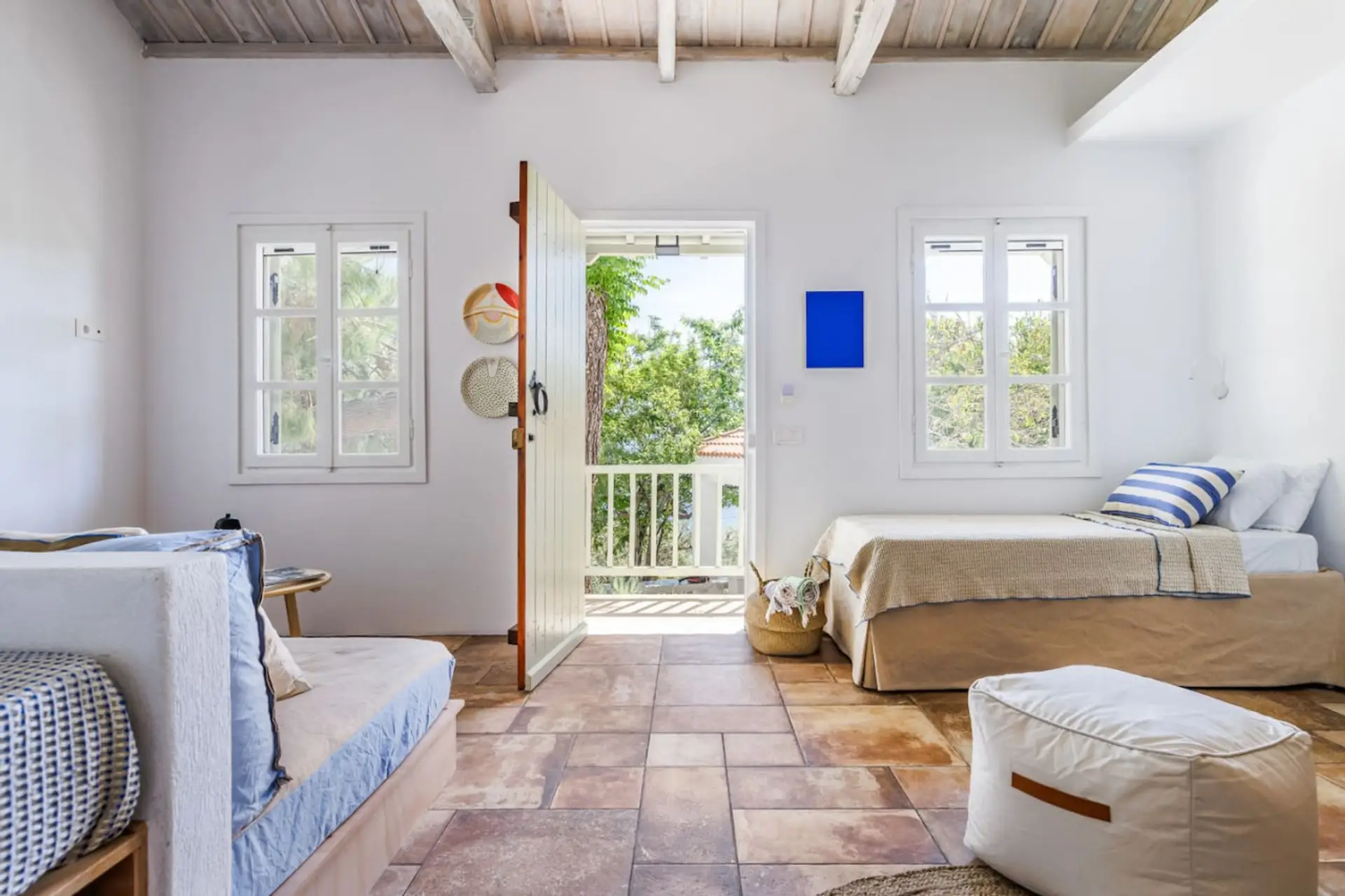 The first bedroom with two comfortable double beds and a cozy single bed, which it comes with ensuite bathroom