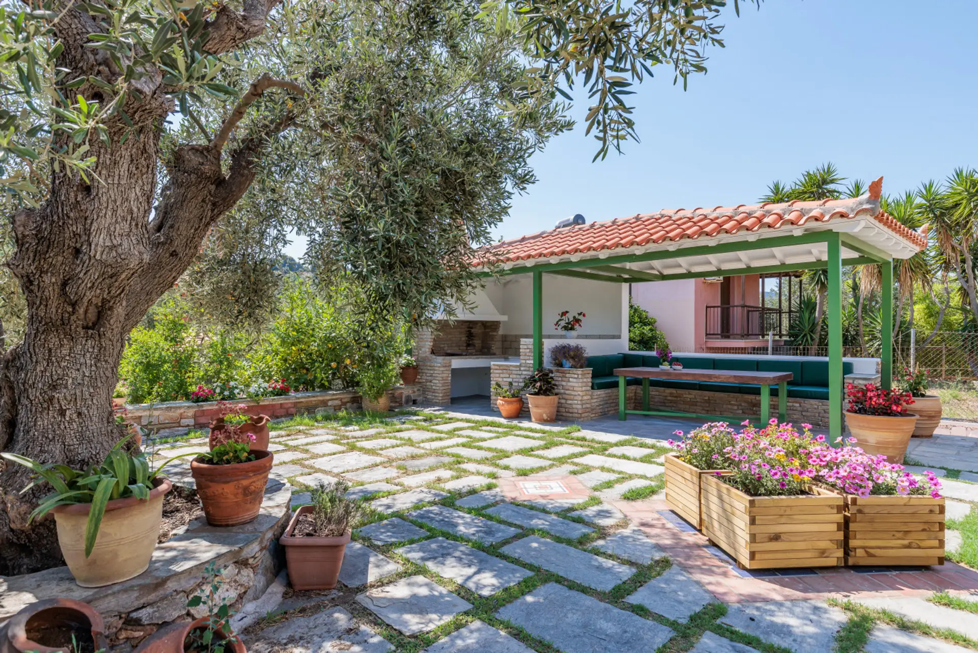 Shared garden and barbecue area with shaded seating