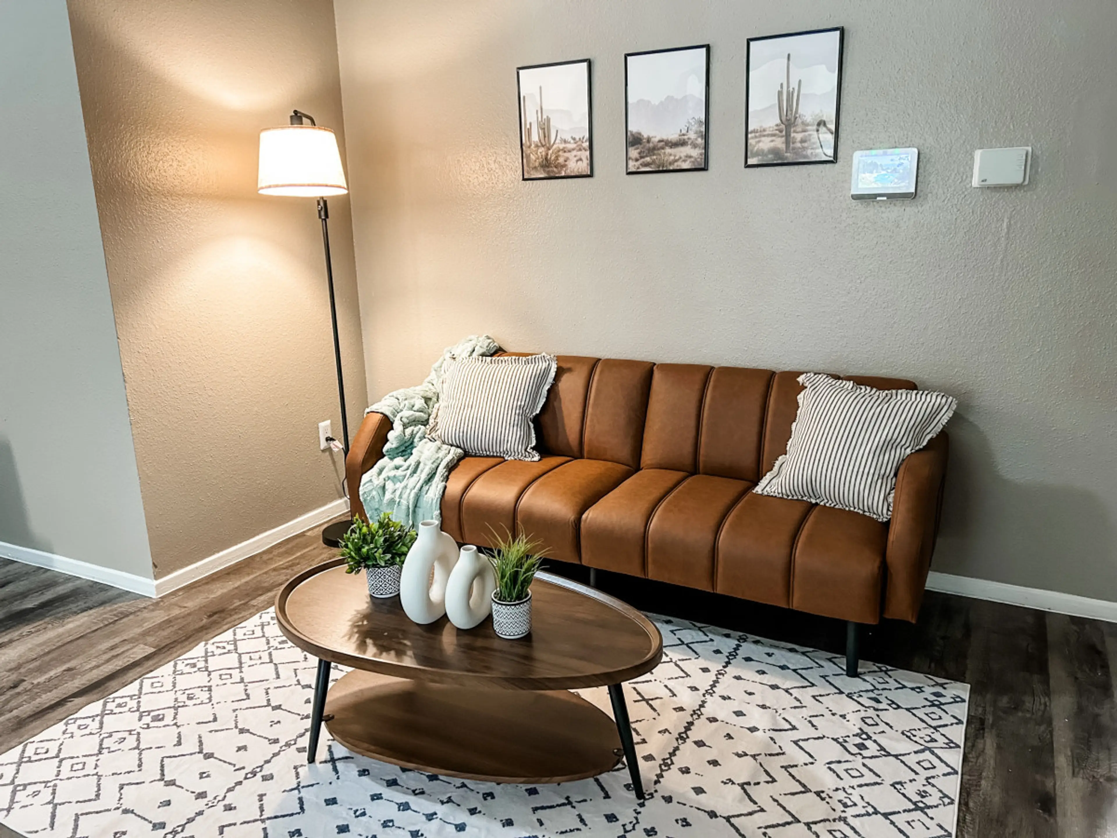 This living space is the heart of the home – featuring vaulted ceilings, futon couch bed, Texan decor, and a perfect blend of comfort and charm.