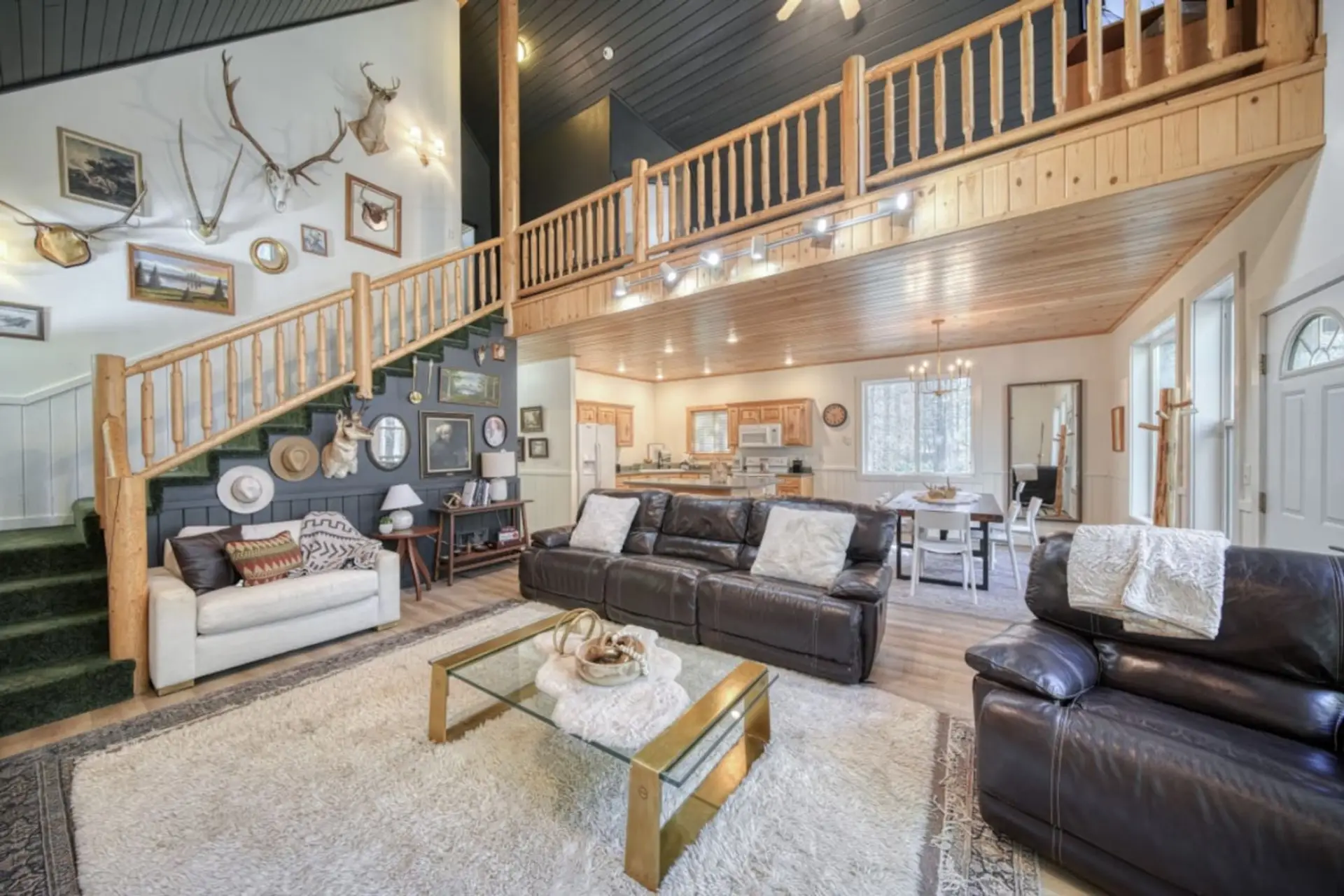 Spacious Living Room with vaulted ceilings and balcony view