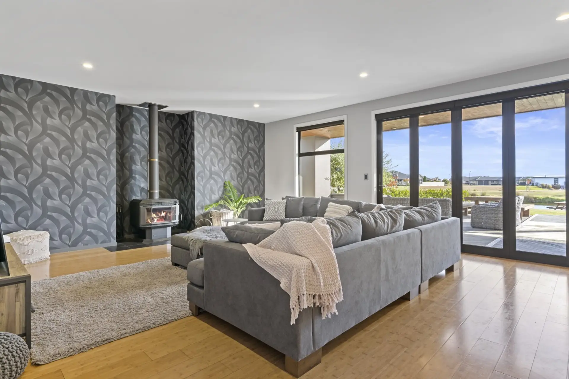 A welcoming lounge seamlessly connects to the dining, kitchen and outdoor spaces.