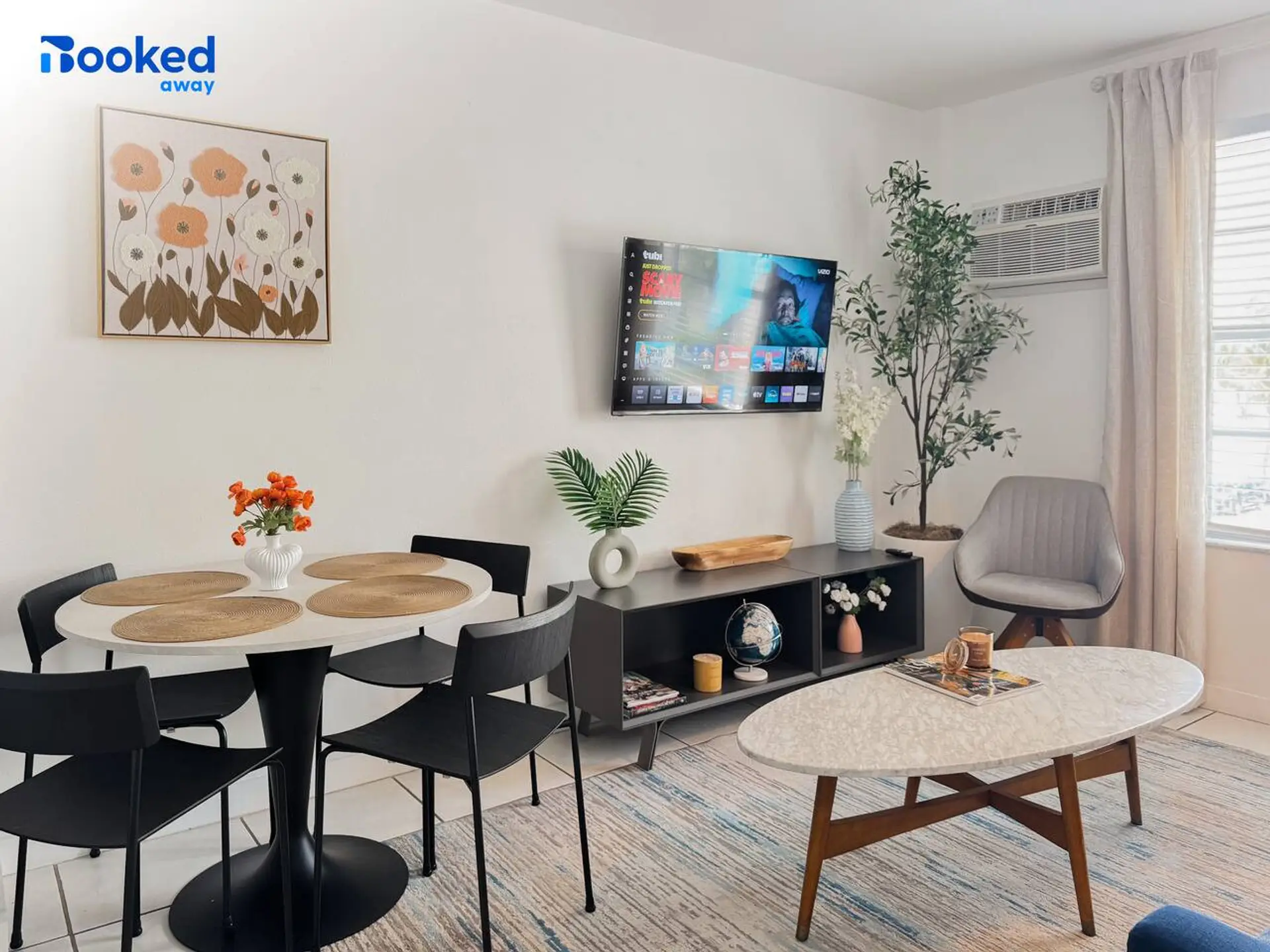 Bright open living & dining space with smart TV