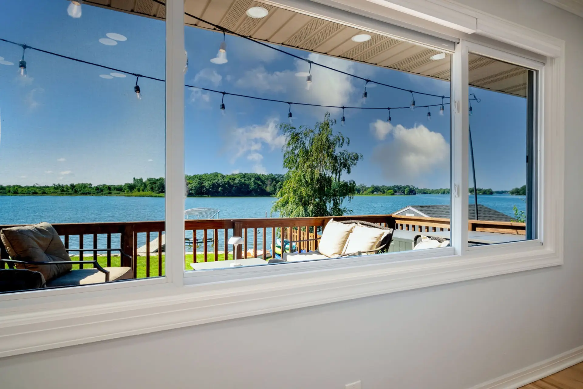 Your panoramic lake views from the dining and main living room large window area
