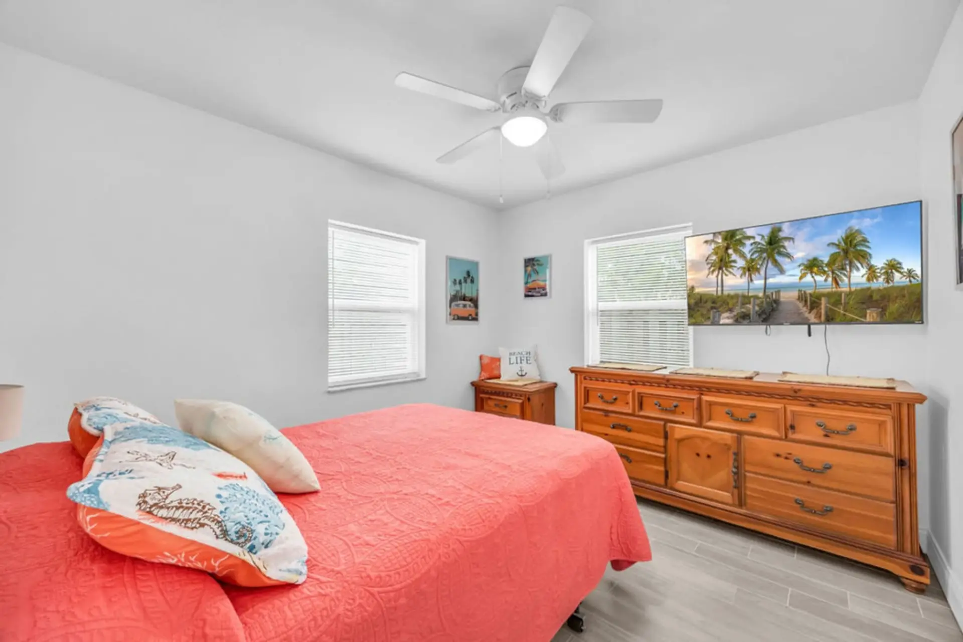 The Melbourne, FL retreat offers a cozy bedroom with a queen bed, fan, heating, clothing storage, TV & more.