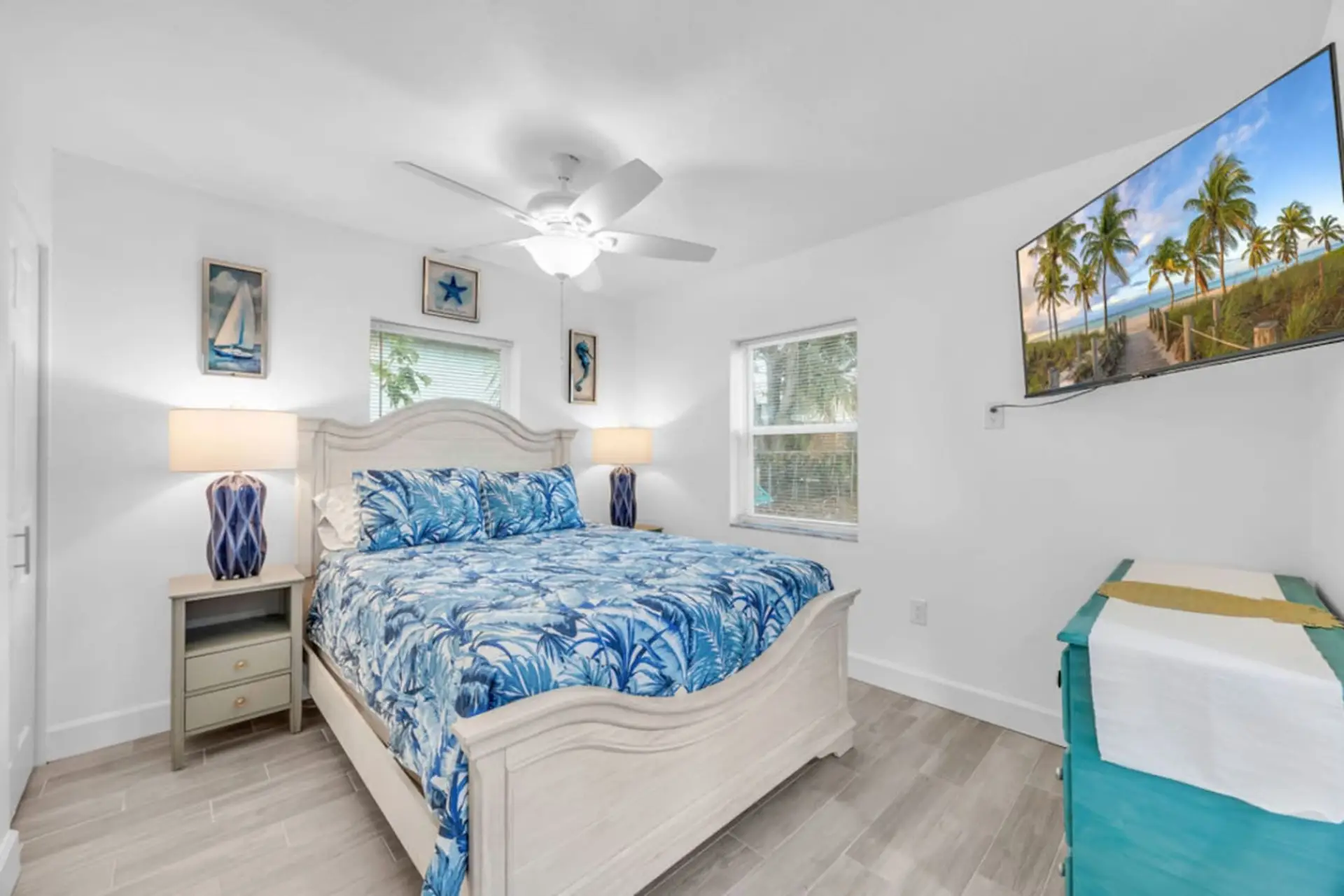 The Melbourne, FL retreat offers a cozy bedroom with a queen bed, fan, heating, clothing storage, TV & more.