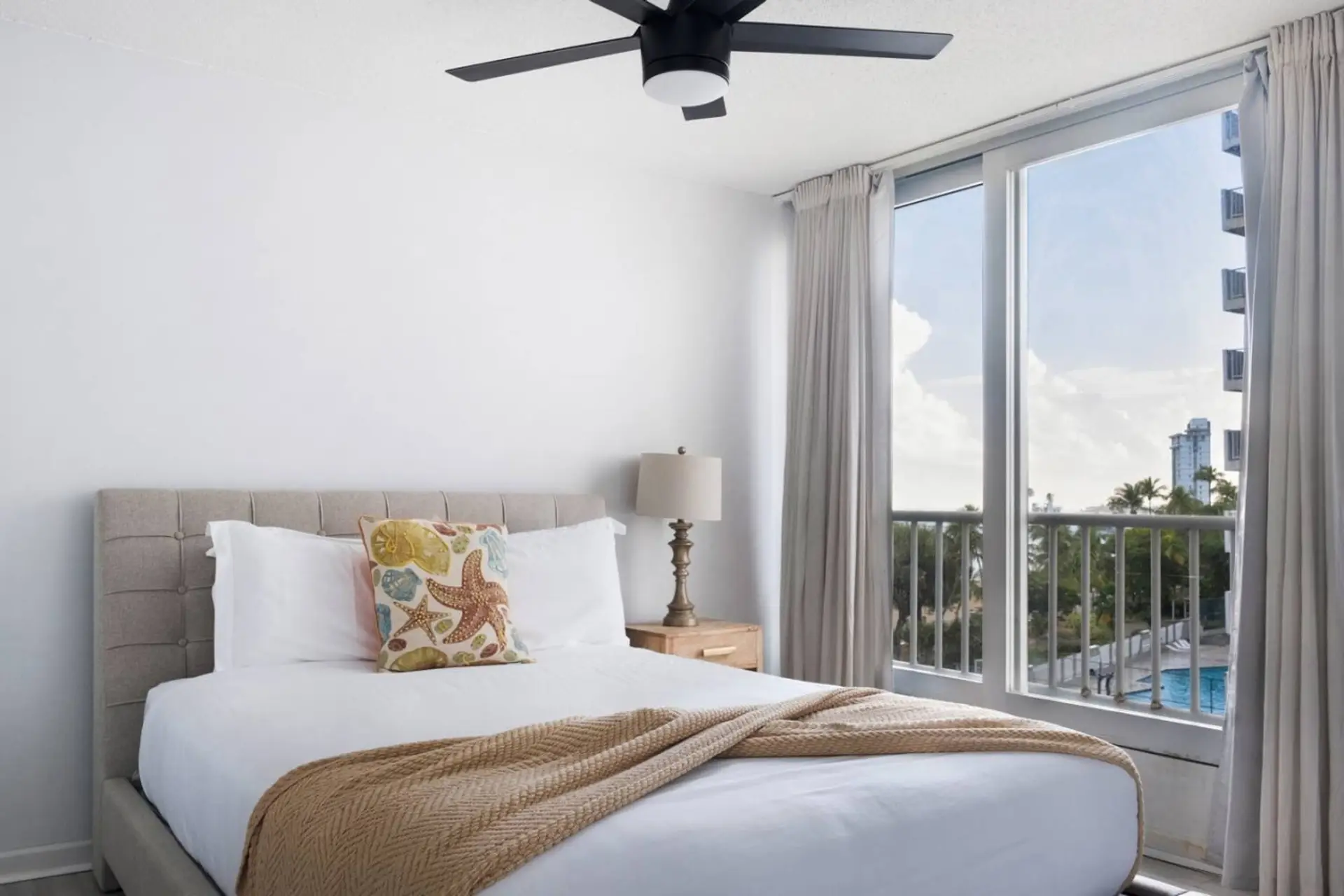 Queen bed and AC in this loft style studio apartment