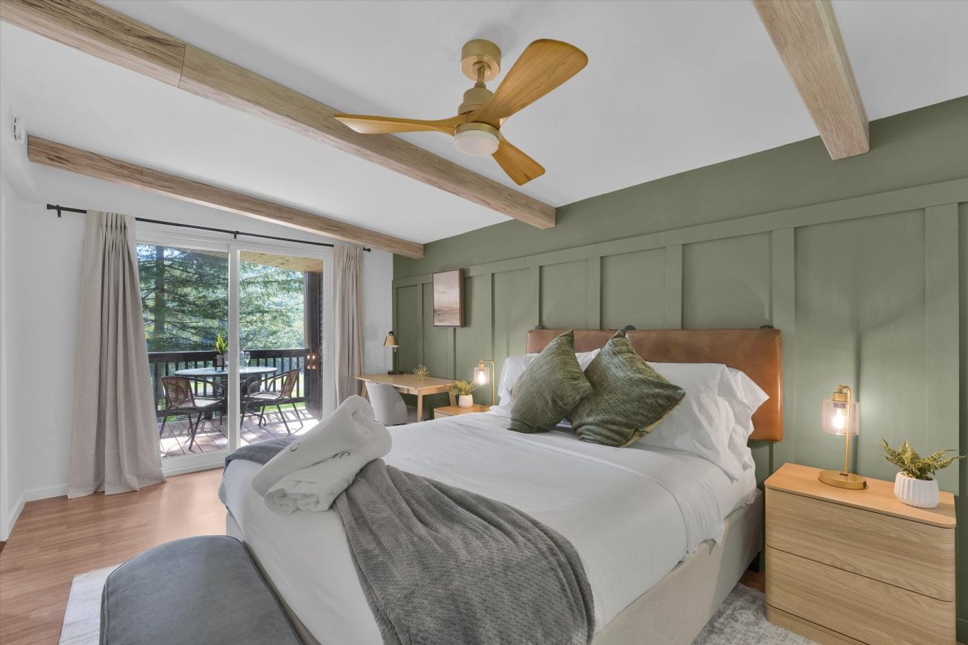Bedroom with a queen bed and sliding doors