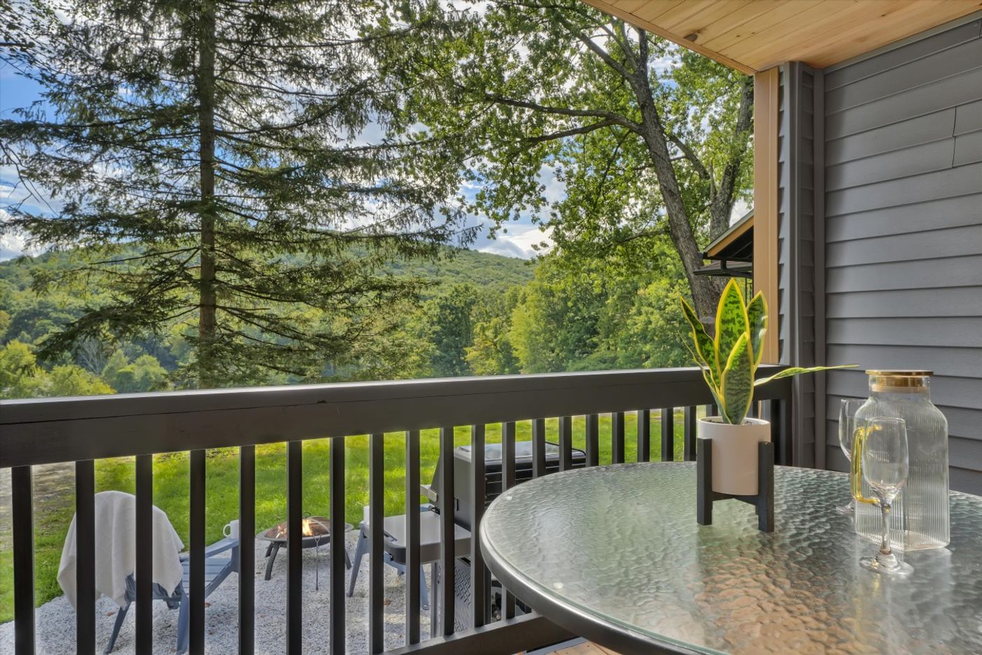 Deck with a table looking into the woods