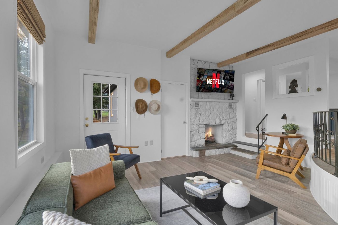 Living room with a TV and armchairs