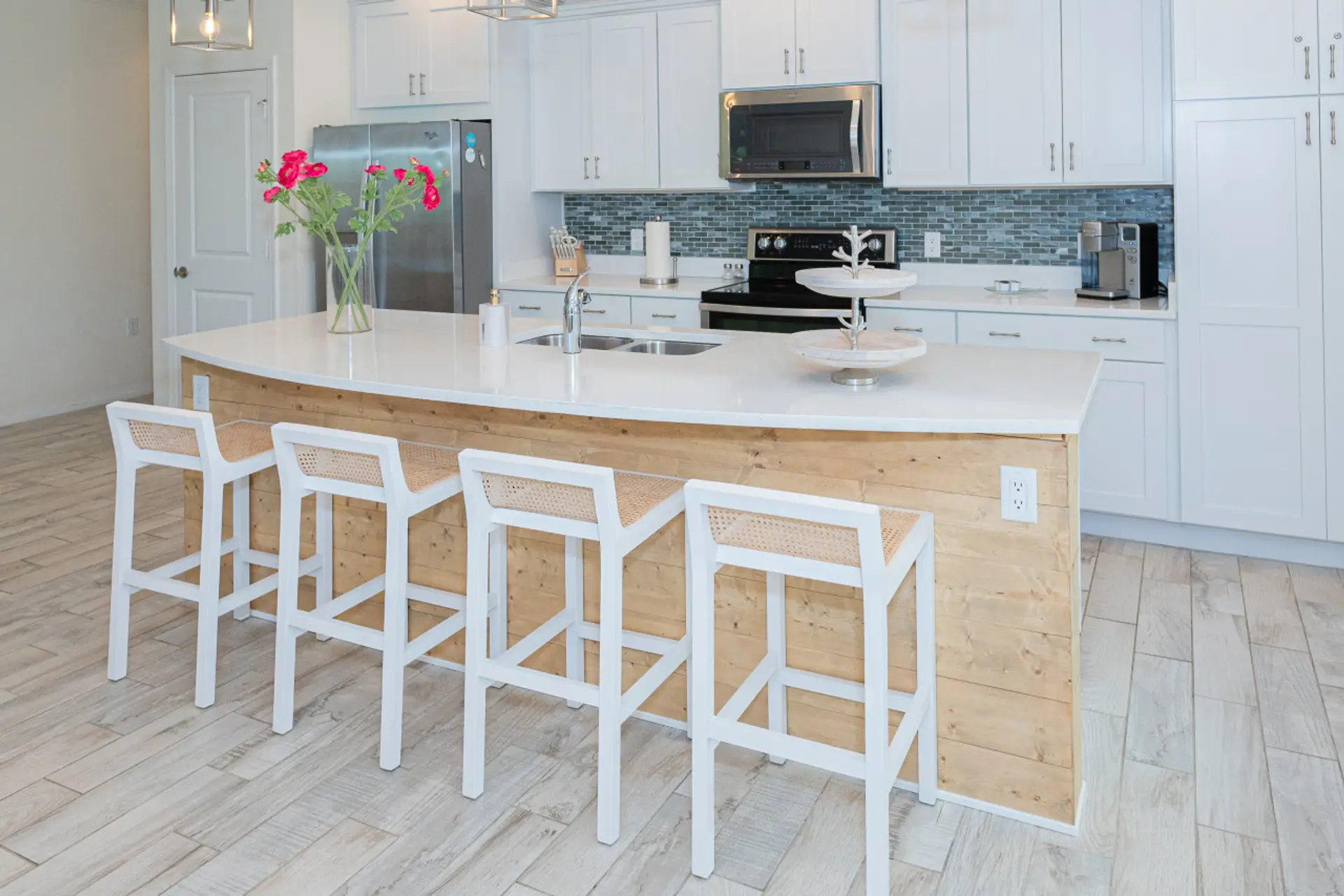 Enjoy our modern kitchen, complete with top-of-the-line appliances and a cozy breakfast island for casual dining