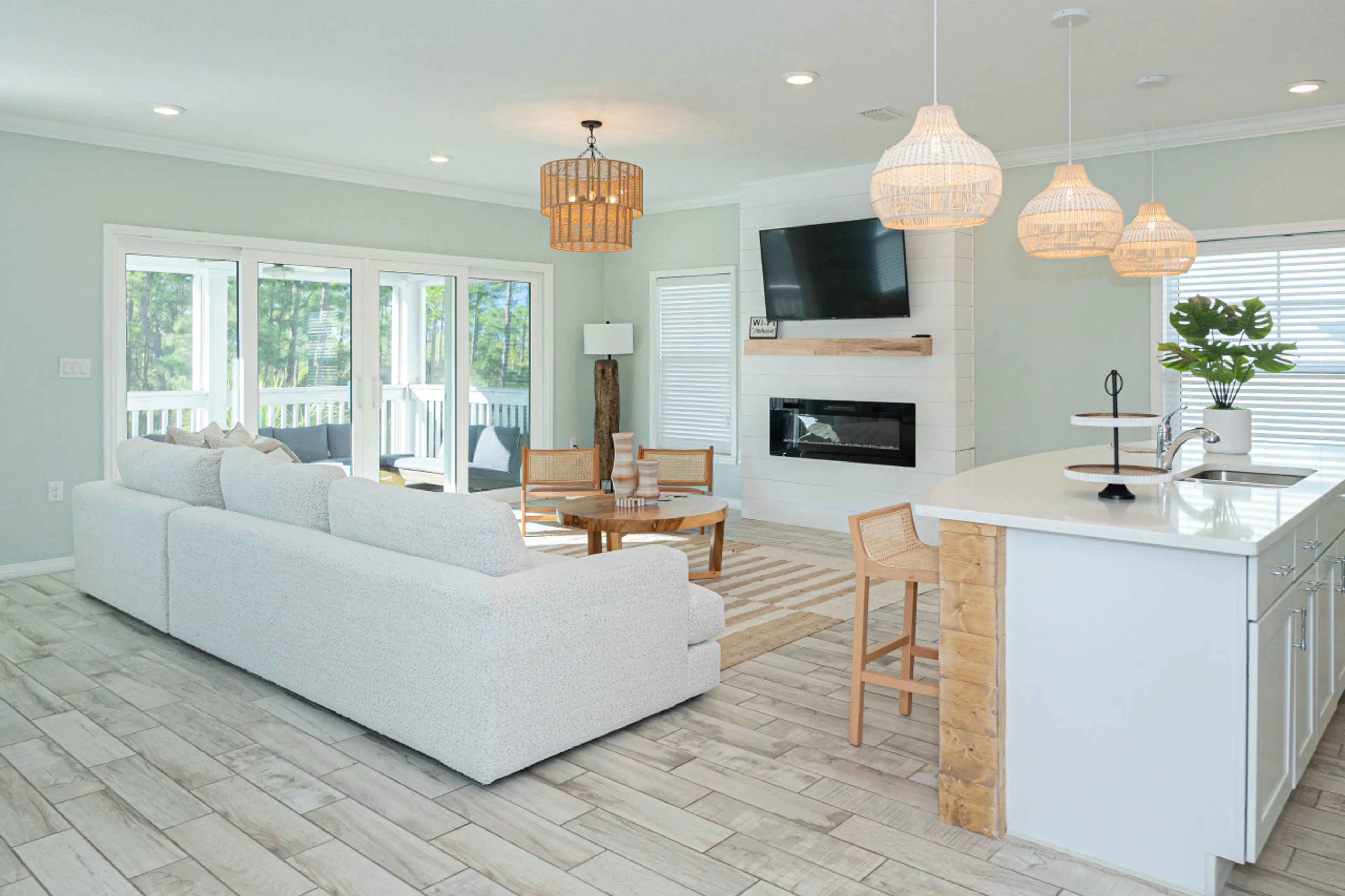 Gather with loved ones in this inviting open-plan living area, where the kitchen and living room flow together effortlessly.