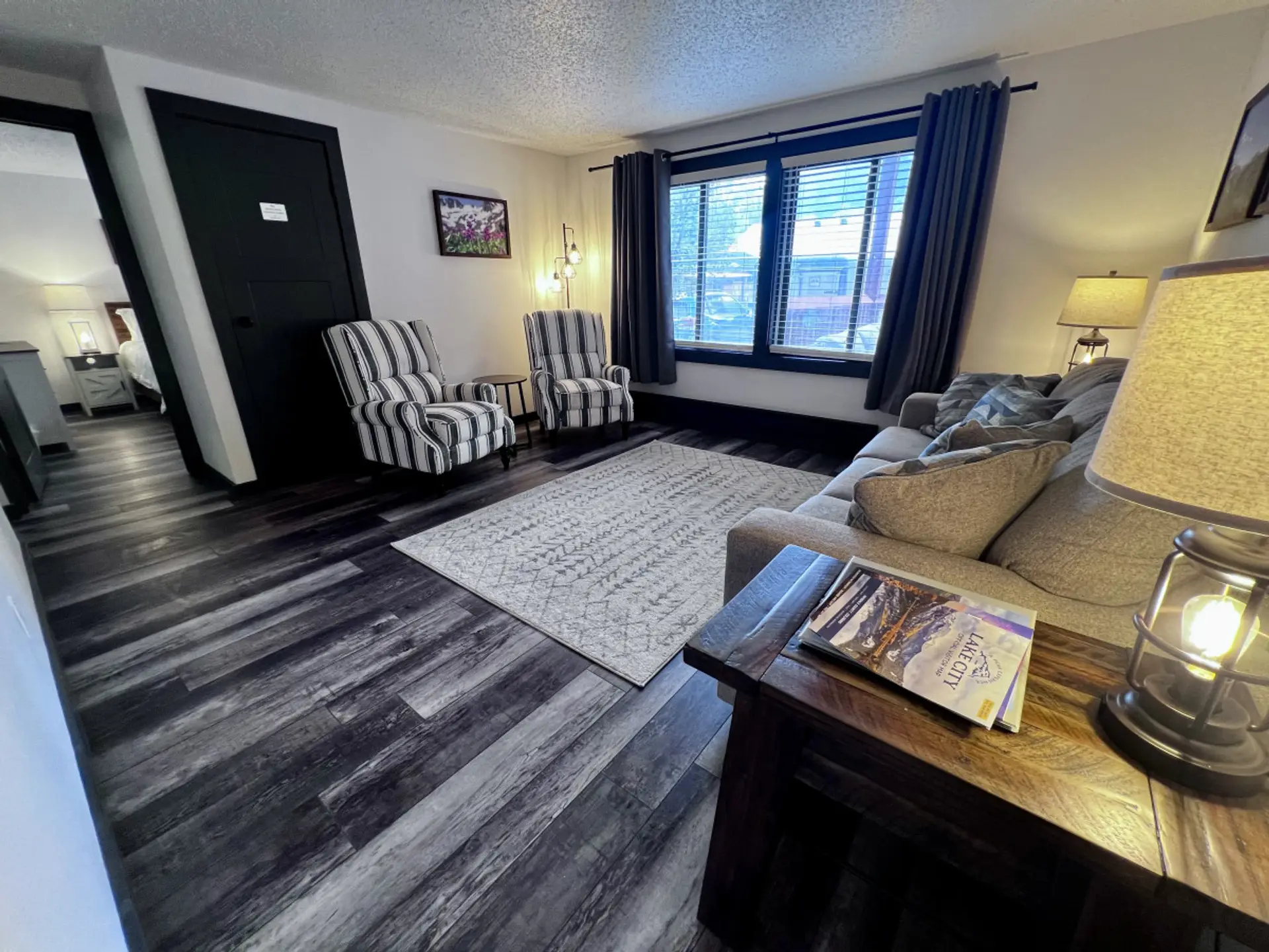 Living room includes 2 reclining chairs, queen size sleeper sofa, and Smart TV.