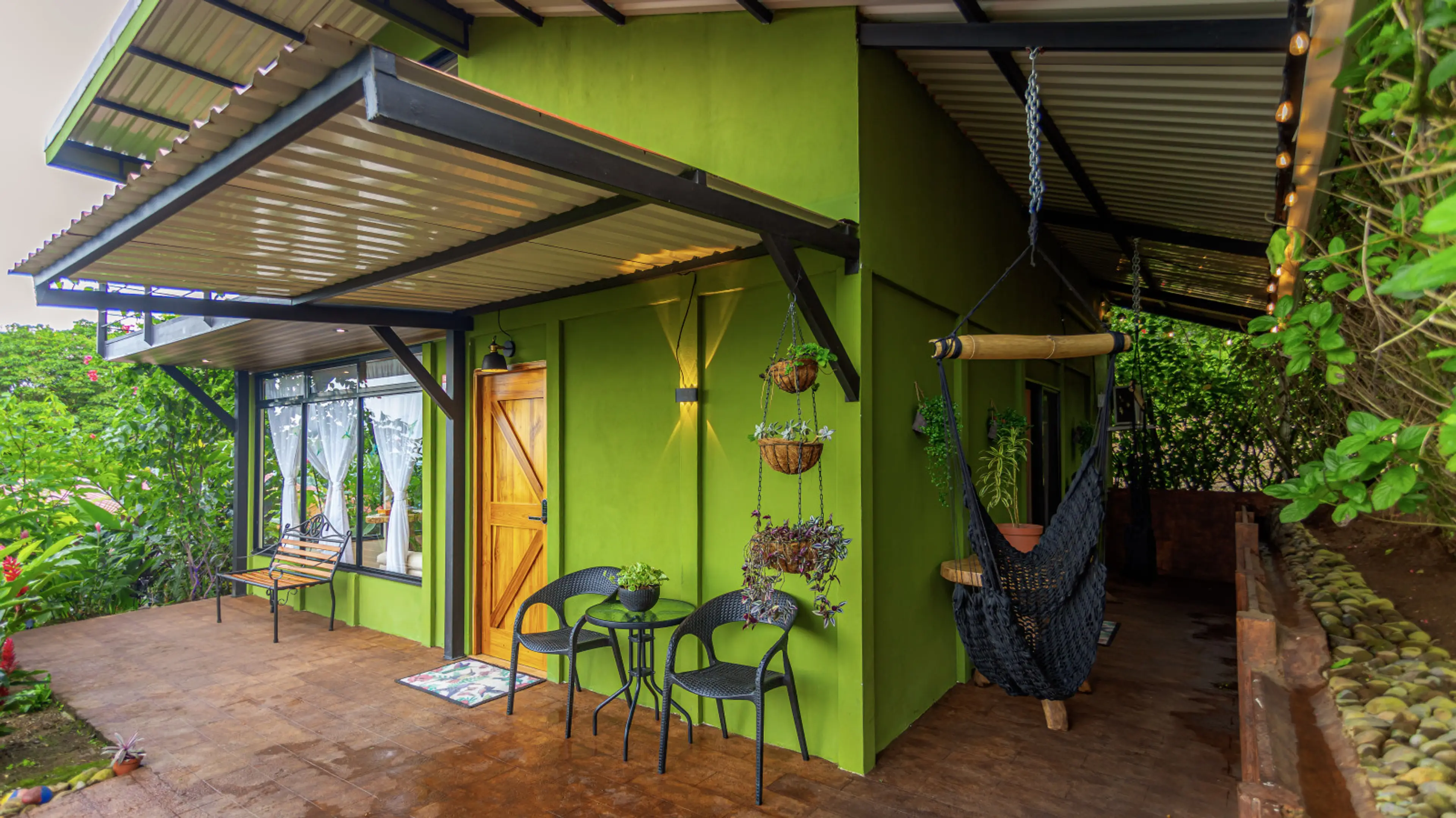 Cabin exterior and patio with chair hammocks